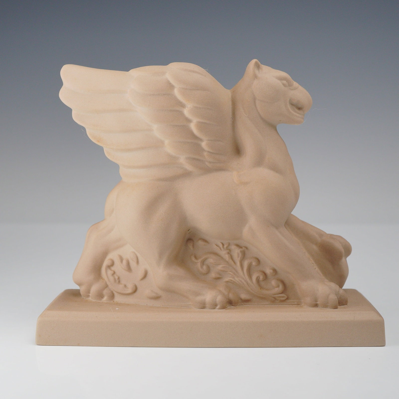 Wedgwood The Noble Line Limited Edition Figurine, Columbia Griffin: This is a limited edition "Columbia Griffin" figurine from the Noble Line of Wedgwood. The piece is crafted from matte-finished, unglazed stoneware in a light buff or terracotta tone. The sculpture de