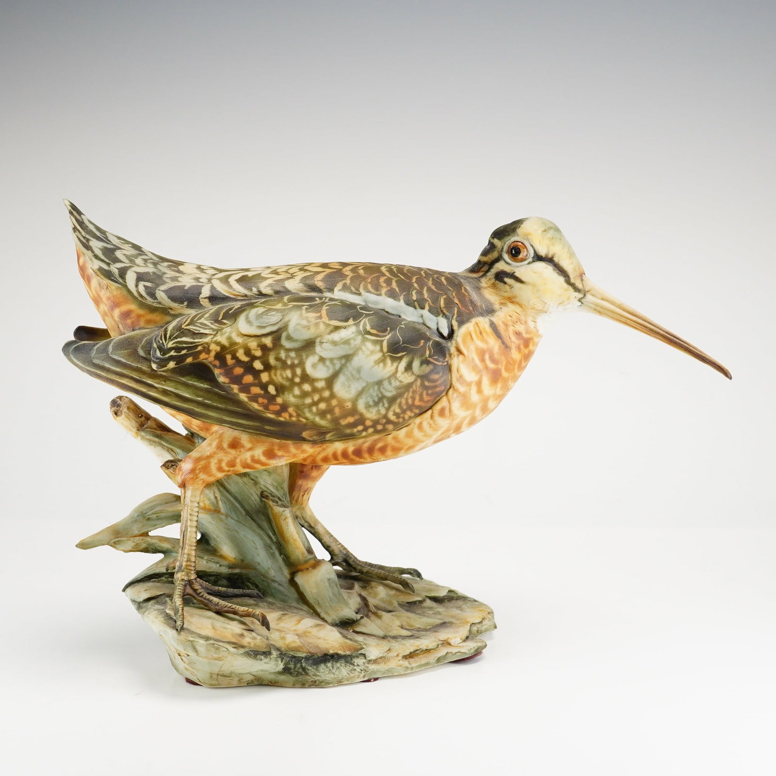 Tay Italy Porcelain Figurine by Giuseppe Tagliariol, Woodcock: This porcelain figurine depicts a woodcock standing on naturalistic base. The top of base is signed G. Tagliariol. The underside is stamped limited edition 500 pieces, and incised Tay, Woodcock, and b