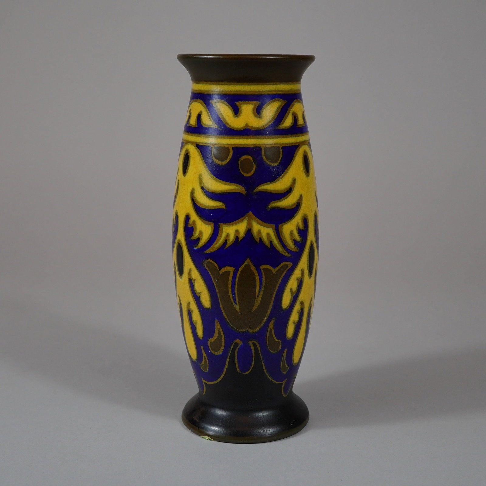 Dutch Gouda Earthenware Vase in Kaya Pattern: A Dutch Gouda earthenware vase manufactured by Platelenbakkerij Zuid-Holland (PZH). The vessel features a slender, tapered ovoid form with a flared rim and a small pedestal foot. It is decorated in th