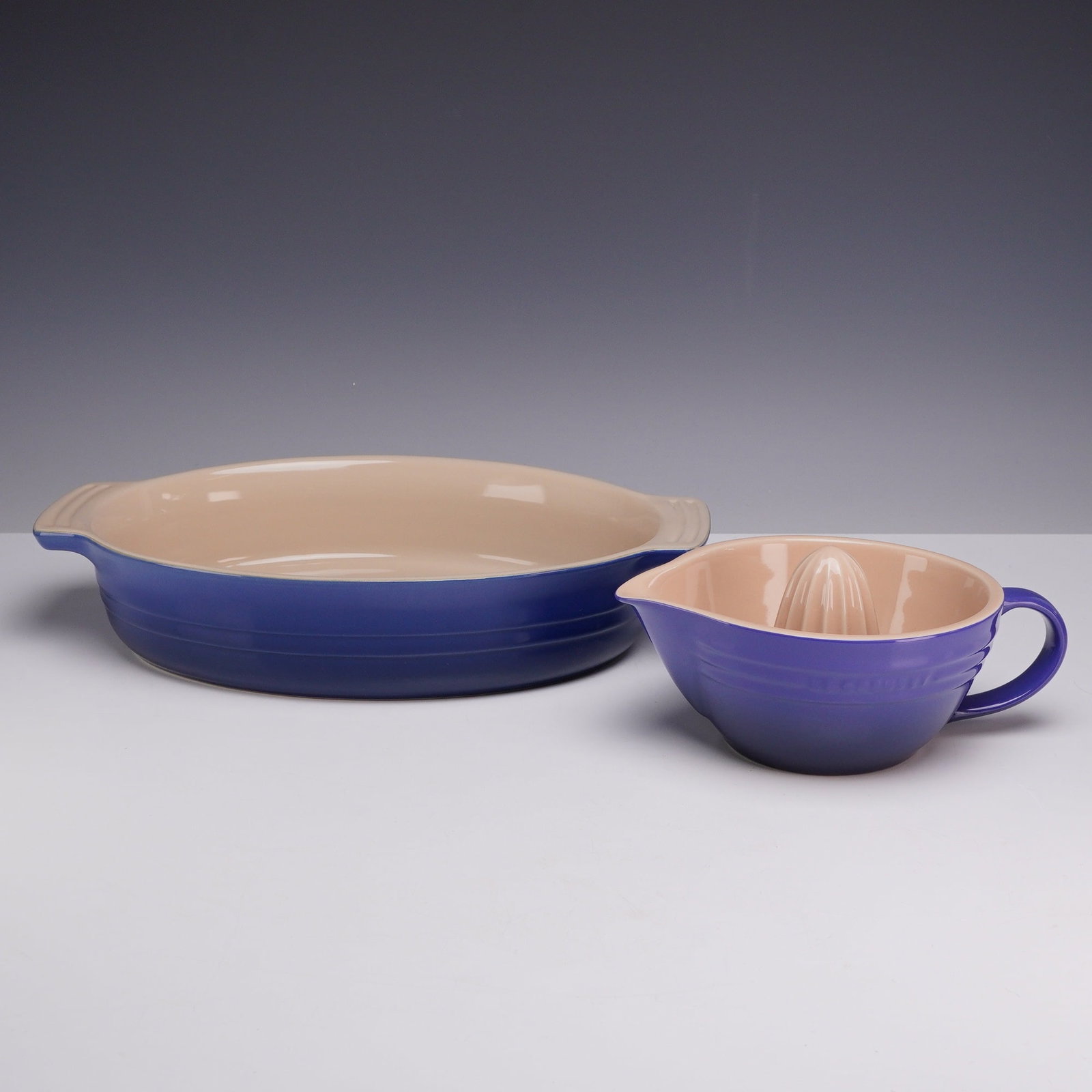 Two Le Creuset Cobalt Blue Enameled Items Including an Oval Baking Dish and a Citrus Juicer (1 of 4)
