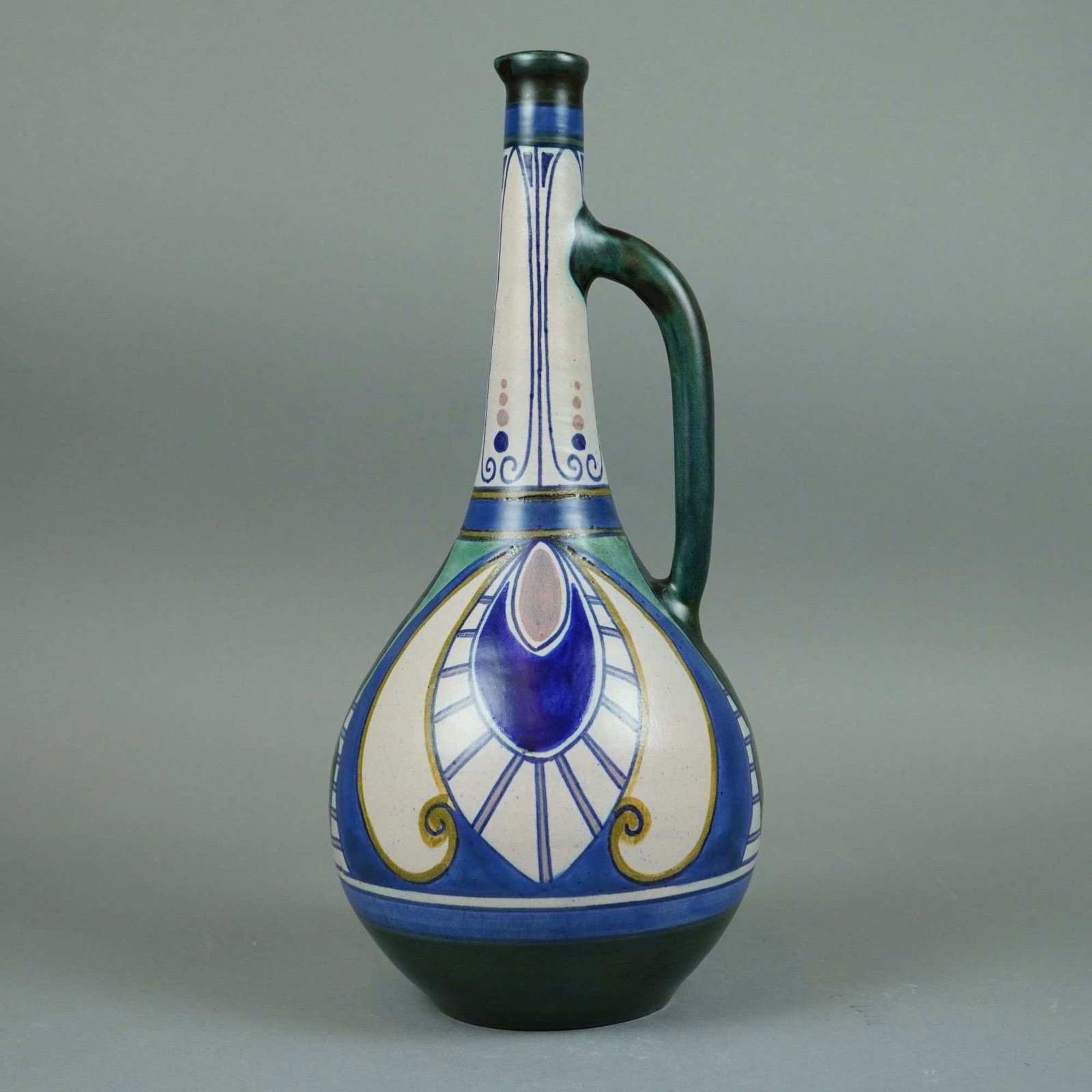 Zuid Holland Gouda Damascus Pattern Art Pottery Ewer: A hand painted glazed earthenware ewer in the Damascus pattern by Plateelbakkerij Zuid-Holland (PZH). The form features a bulbous lower body that tapers into a long narrow neck with a single high