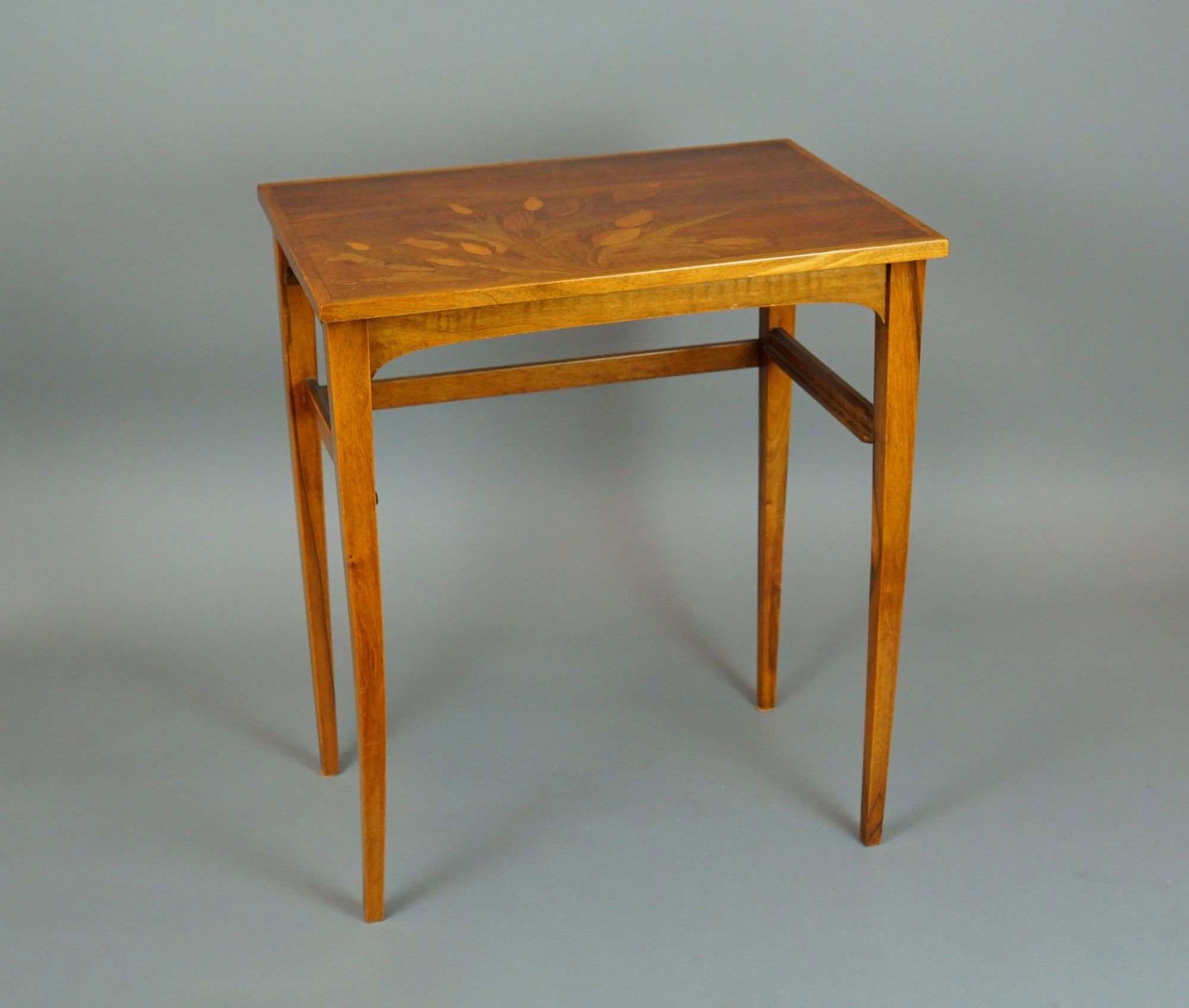 French Art Nouveau Marquetry Side Table by Emile Galle: A French Art Nouveau hardwood side table featuring a detailed multi-wood marquetry top depicting a bouquet of flowering tulips. The rectangular top utilizes various wood grains to provide depth and