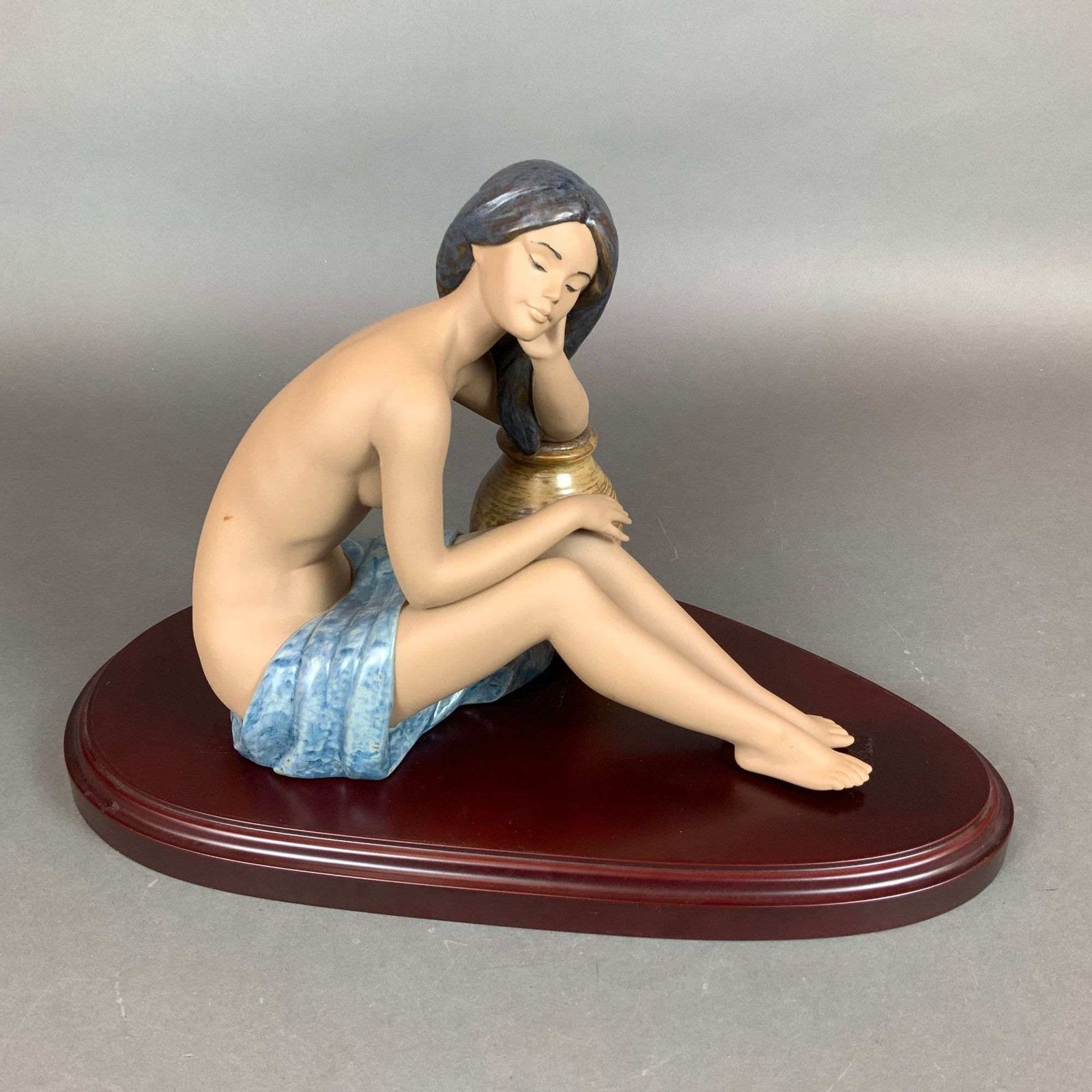 Lladro Gres Porcelain Figurine, My Memories 01012392 with Base: A Lladro gres porcelain figurine titled My Memories, designed by artist Miguel Angel Santaeulalia. The sculpture depicts a partially nude female figure in a seated, contemplative pose with her head re