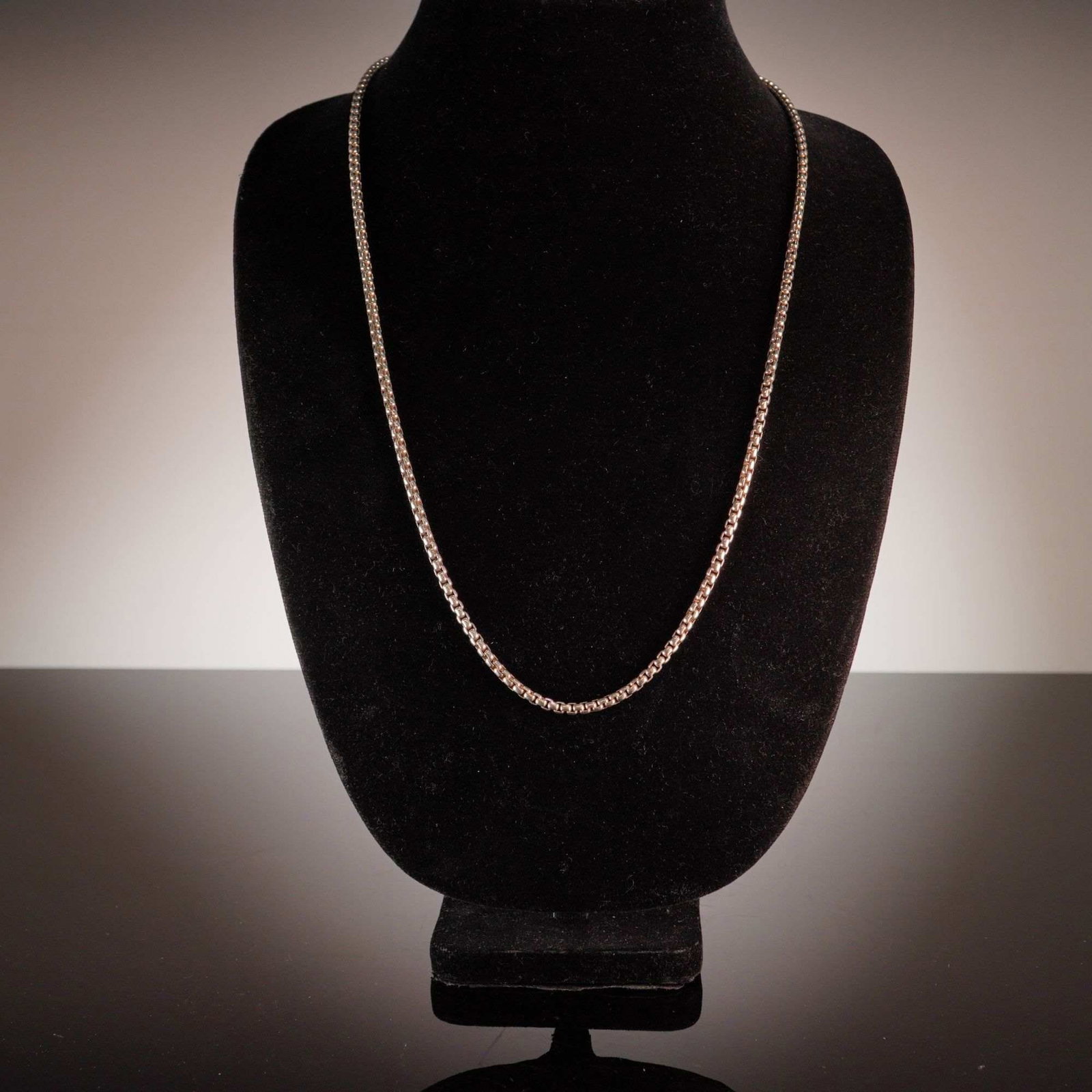 David Yurman Sterling Silver and 14 Karat Yellow Gold Box Chain Necklace: A David Yurman box chain necklace featuring interlocking square silver links. The piece terminates in a secure lobster claw clasp and includes a signature openwork logo tag with the stylized initials 