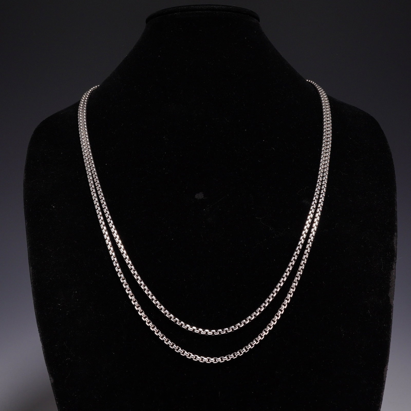 David Yurman Sterling Silver and 14K Yellow Gold 2.7mm Box Chain Necklace: This David Yurman long box chain necklace is crafted from sterling silver with 2.7mm square links. It features a signature lobster claw clasp and an openwork charm near the closure. The item has been 