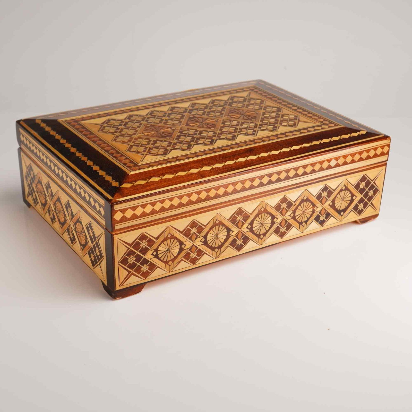 Handmade Russian Straw Marquetry and Mosaic Inlay Wooden Jewelry Box: A rectangular wooden jewelry box featuring handmade straw marquetry and mosaic inlay work, characteristic of Russian folk art craftsmanship. The lid displays an elaborate geometric composition