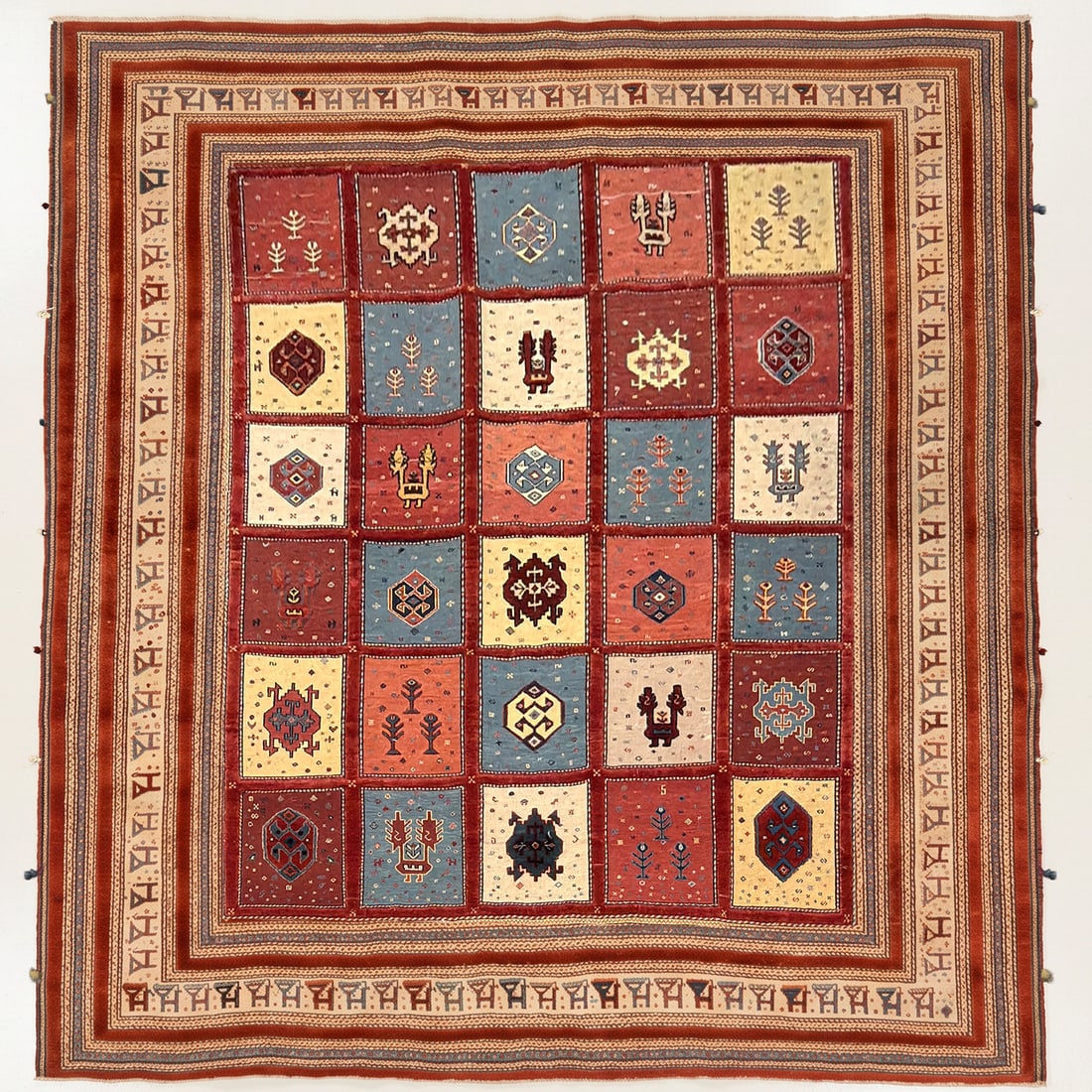 Nimbaft Hand-Knotted Persian Lori Checkerboard Rug: Nimbaft Hand-Knotted Persian Lori Checkerboard Rug is a tribal Persian textile woven by Lori (Lur) weavers of western Iran, combining hand-knotted wool with checkerboard geometric patterning. These ru