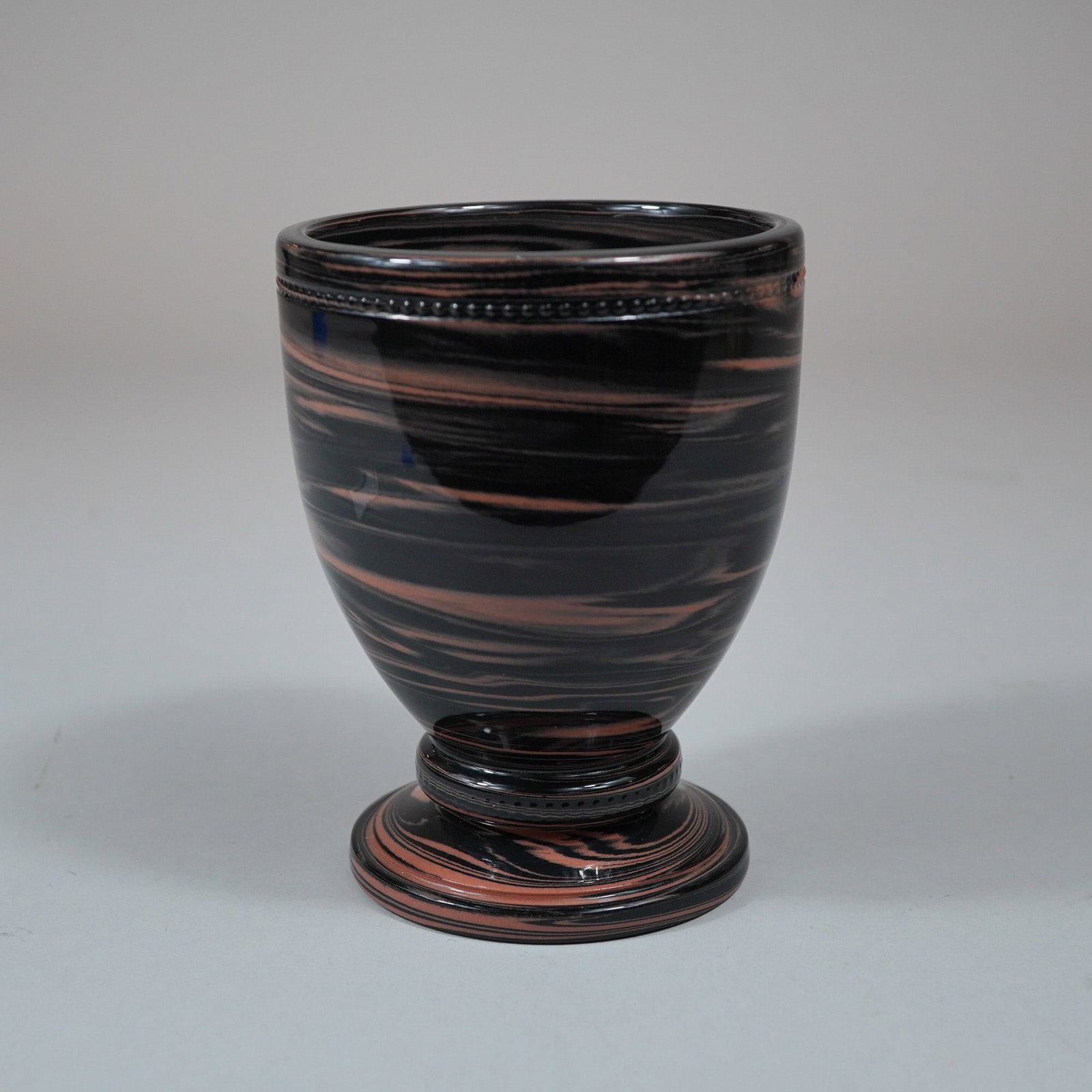 Wedgwood Marbleized Art Glass Chalice: This late 20th-century footed art glass vessel is identified as part of the Rubin Collection by an original silver foil sticker located on the underside of the base. It is designed as a marbleized cha