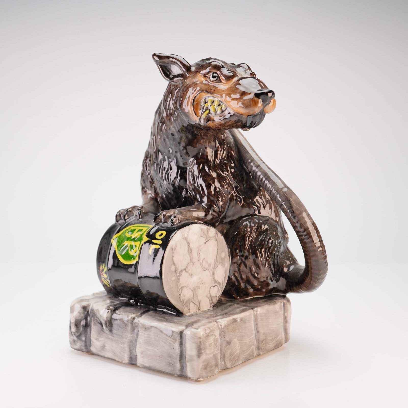 Kevin Francis Banksy Street Art Collection Toxic Rat Ceramic Prototype Figurine: This is a ceramic figure from the Kevin Francis Banksy Street Art Collection, inspired by contemporary urban stencil art. The piece depicts a rat in a crouched position clutching a black barrel labele