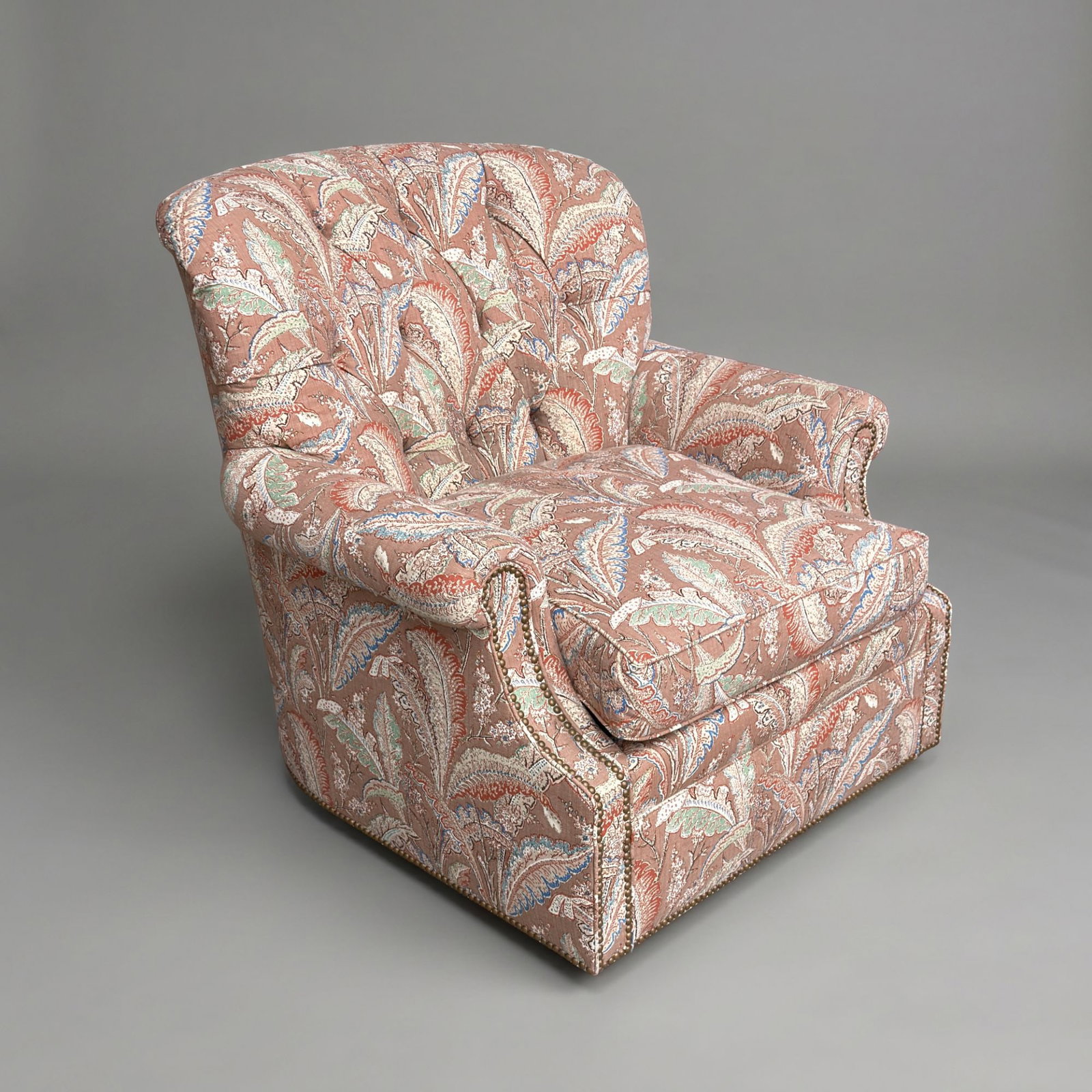 Vintage Custom Button-Tufted Tapestry Fabric Club Swivel Armchair: Paisley tapestry fabric throughout. Tufted back with high rounded backrest with deep diamond tufting with matching fabric-covered buttons and cushioned rolled arms. Nail head trim along arms and