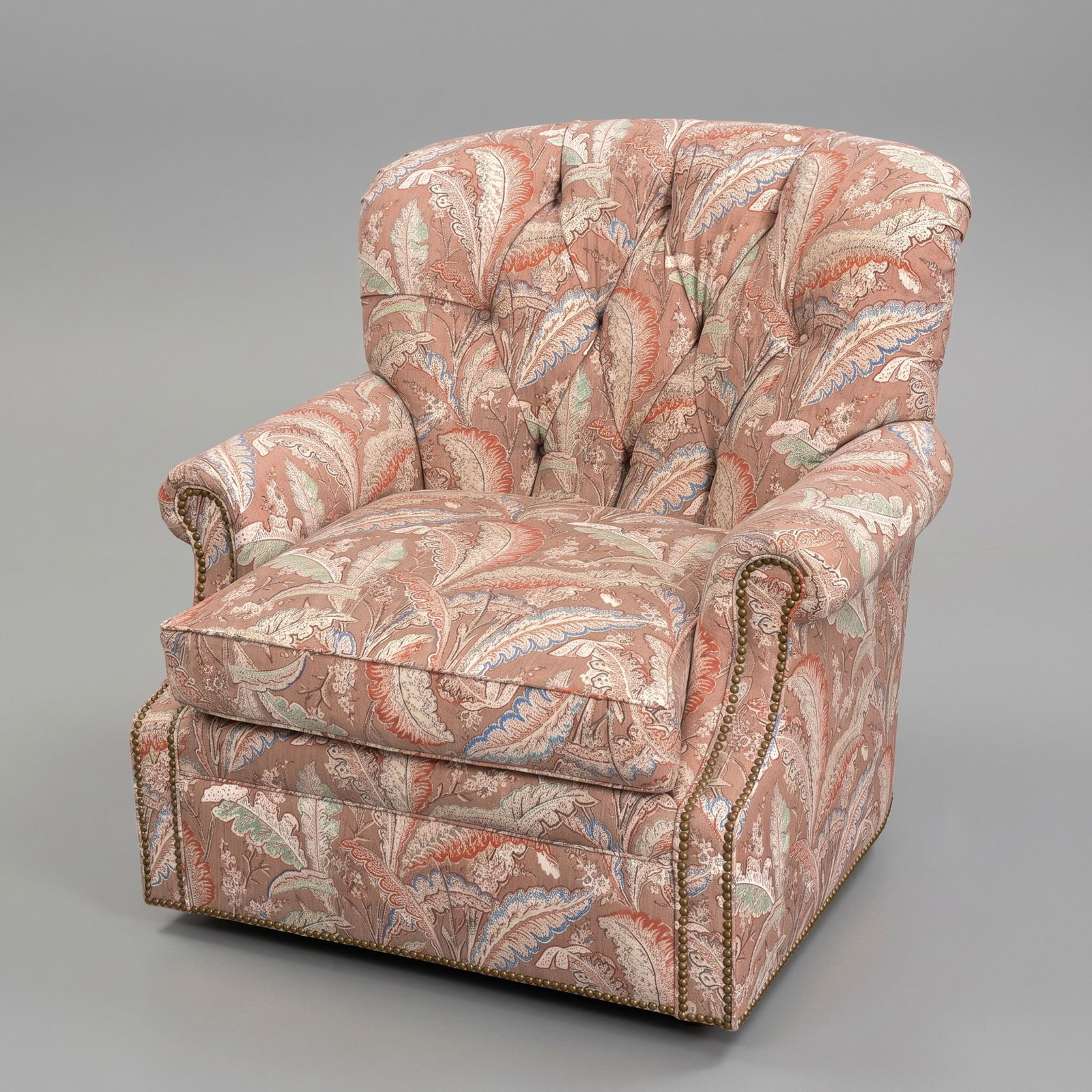 Vintage Custom Button-Tufted Tapestry Fabric Club Swivel Armchair: Paisley tapestry fabric throughout. Tufted back with high rounded backrest with deep diamond tufting with matching fabric-covered buttons and cushioned rolled arms. Nailhead trim along arms and