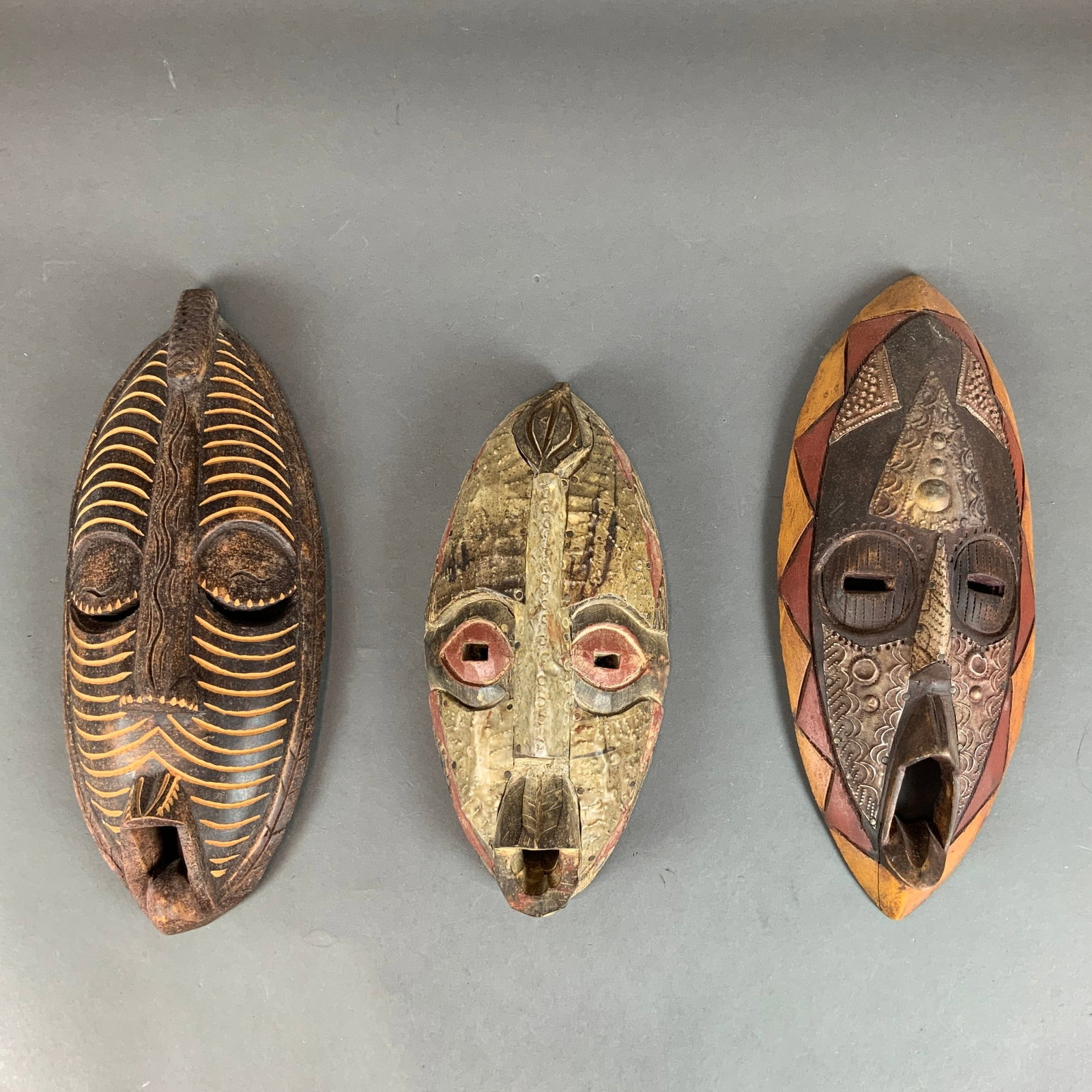 Three Hand-Carved Ghanaian Decorative Tribal Masks, Two Embellished with Tin (1 of 3)
