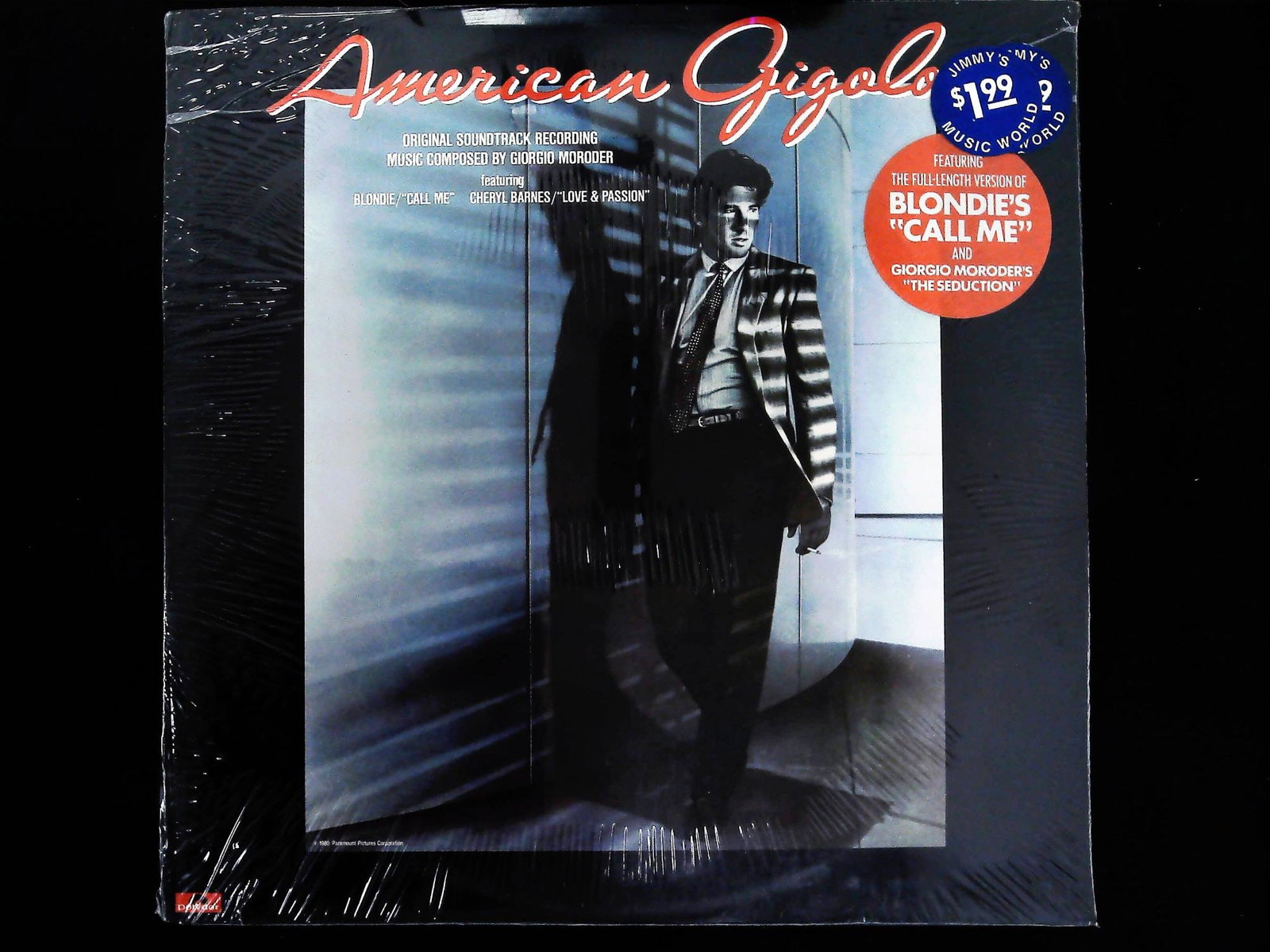 American Gigolo Original Soundtrack LP: A single sealed Long Play (LP) vinyl record album for the 1980 film American Gigolo. This original soundtrack recording features music composed by Giorgio Moroder and prominently includes Blondie's hi