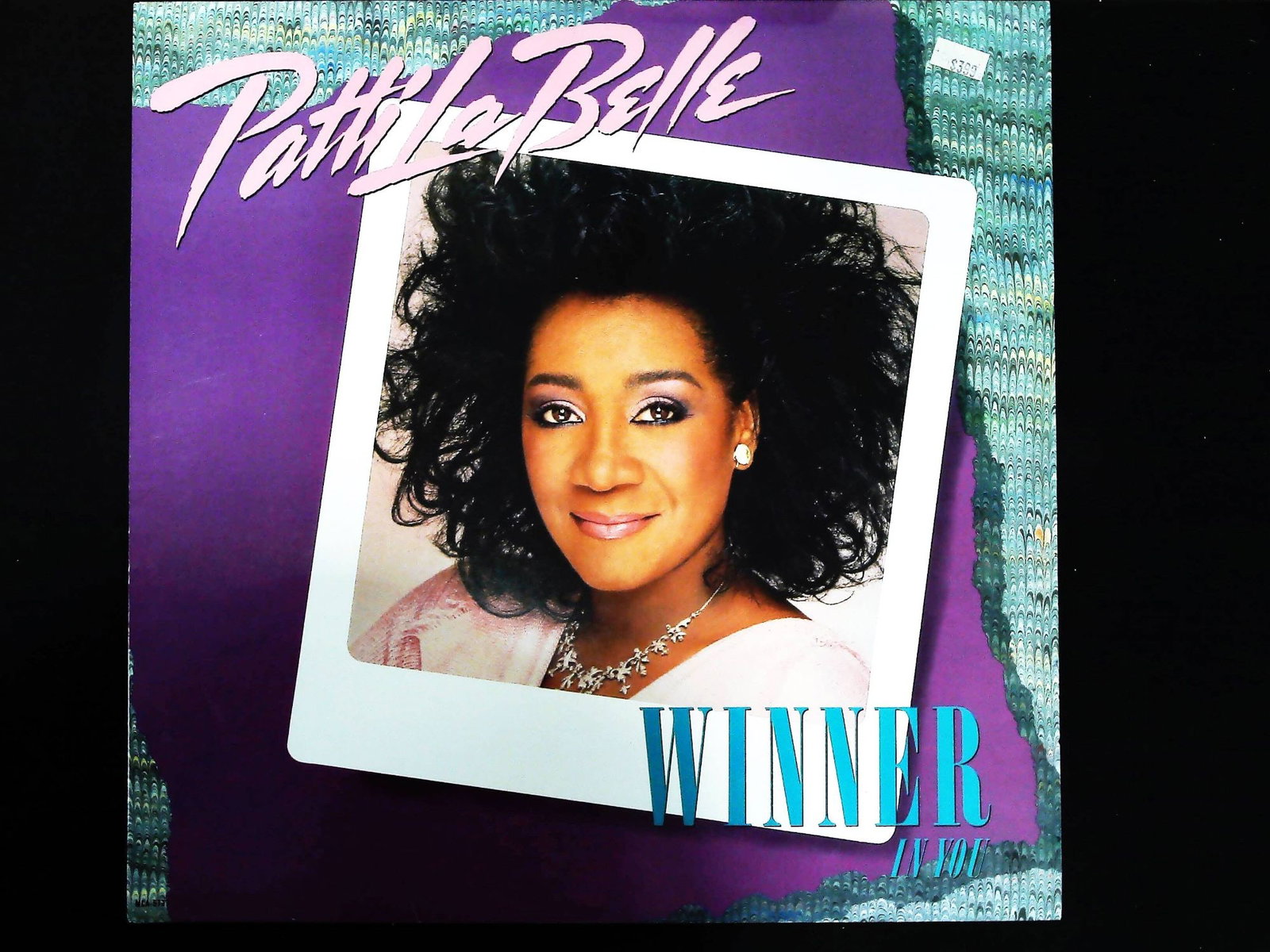 Patti LaBelle Winner In You Vinyl LP Record MCA-5737: A single vintage vinyl LP record album, Patti LaBelle's 1986 release Winner In You. The album consists of a black vinyl disc housed in a color-printed cardboard sleeve. The record was released by MCA 