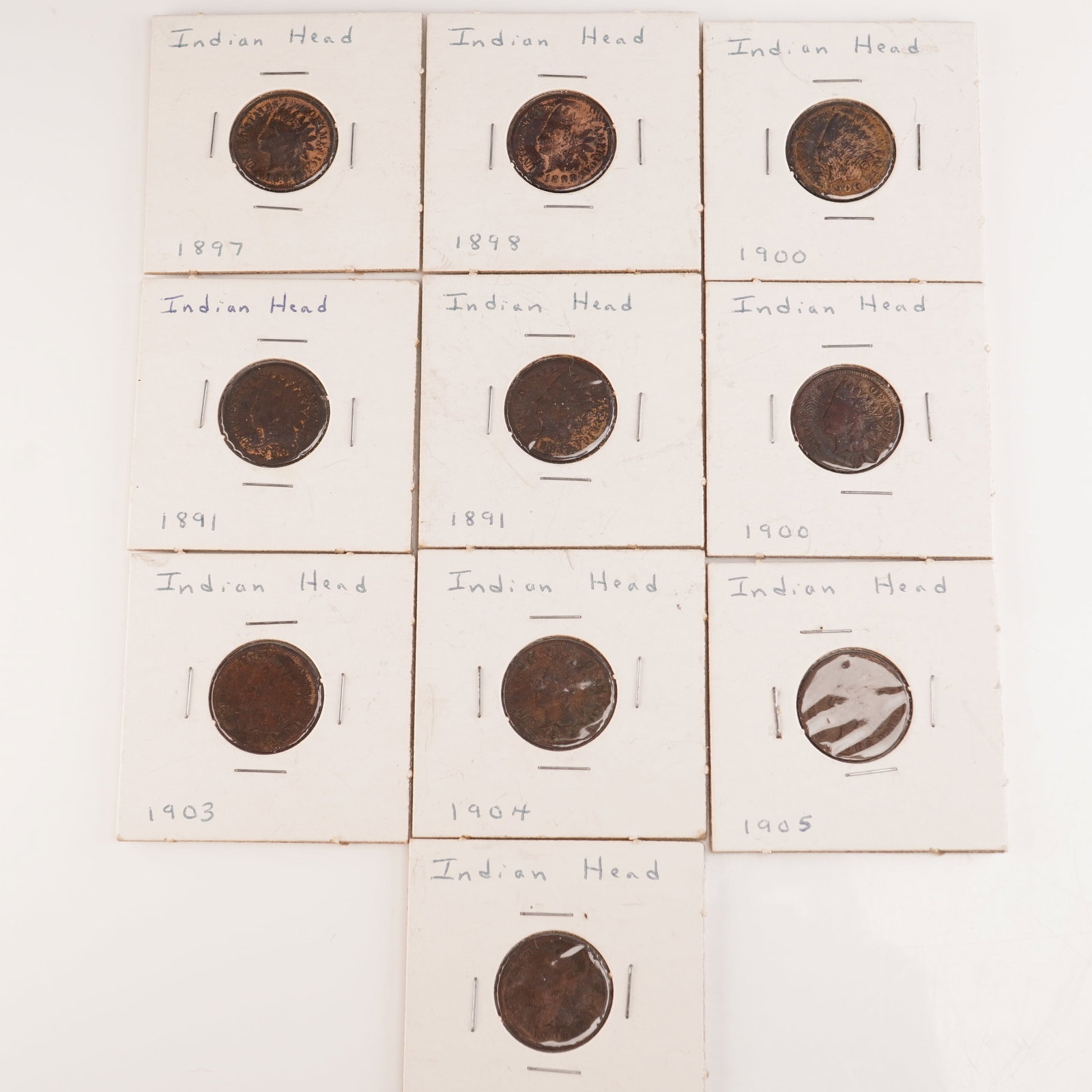 10pc 1891-1905 U.S. Indian Head One Cent Coins: Collection of ten Indian Head one-cent coins dated 1891-1905. The group includes two 1891 coins, one 1897, one 1898, two 1900, one 1901, one 1904, and two 1905 examples. The obverse of each coin featu