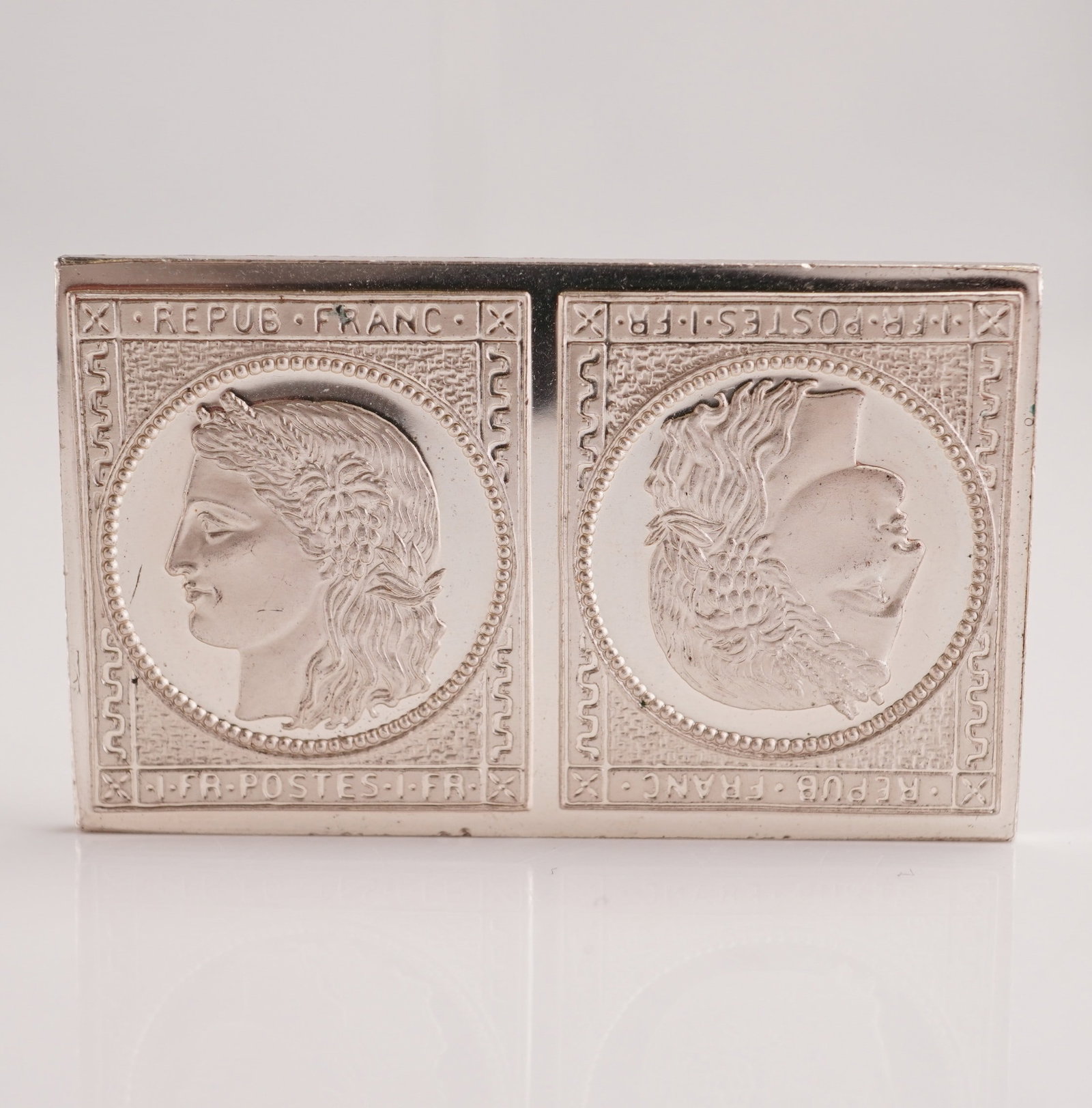 Sterling Silver Ingot Reproduction of 1849 French 1-Franc Stamp, Head of Ceres: Sterling silver ingot reproduction of the 1849 French 1-Franc "Head of Ceres" postage stamp. Crafted in .925 sterling silver (92.25% silver, tested), this piece honors one of the most renowned issues 
