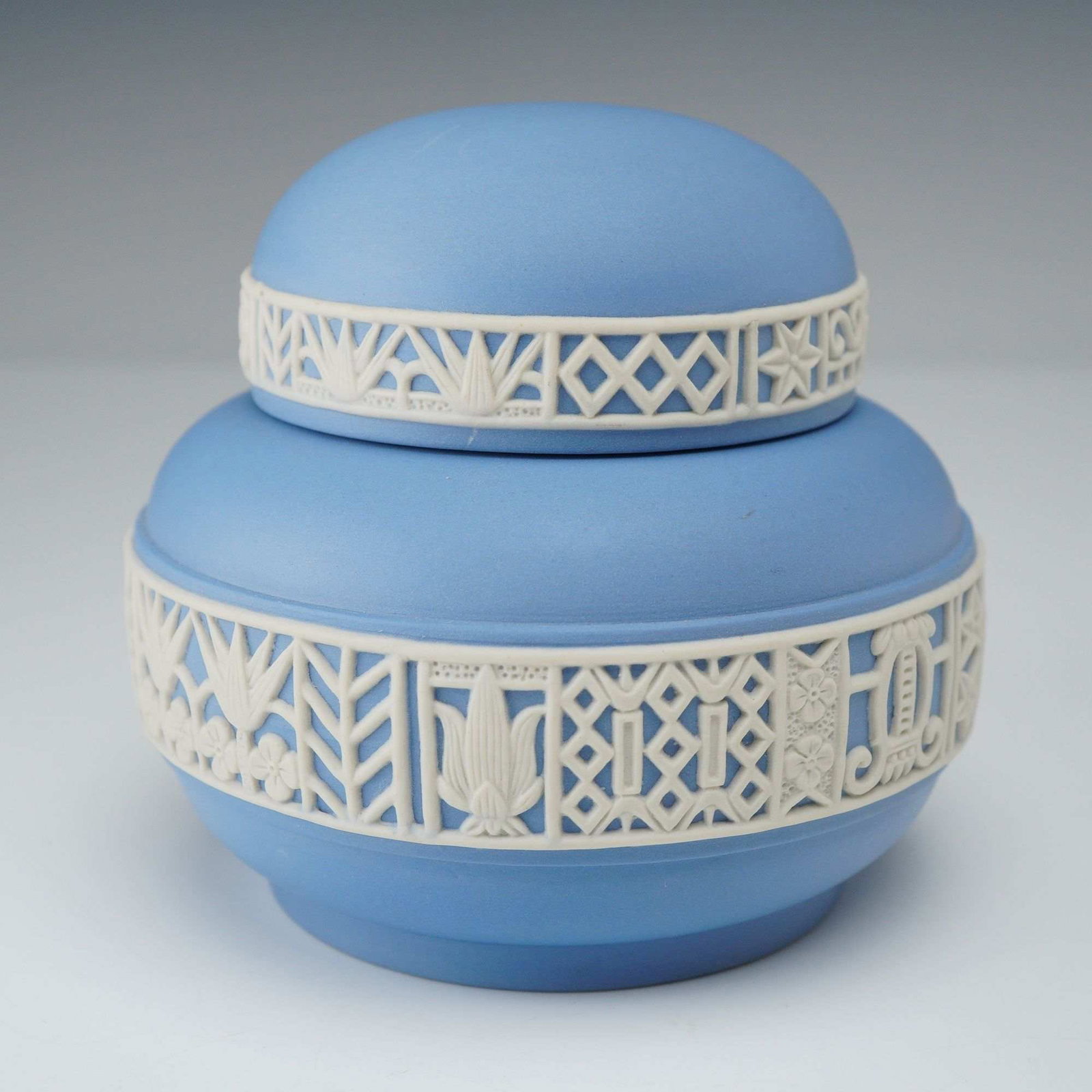 Wedgwood Blue Jasperware Lidded Treasure Box: A mid-century Wedgwood blue Jasperware lidded treasure box designed by Peter Wall, manufactured in England circa 1960. The vessel features a bulbous form with a matching domed lid, executed in a light