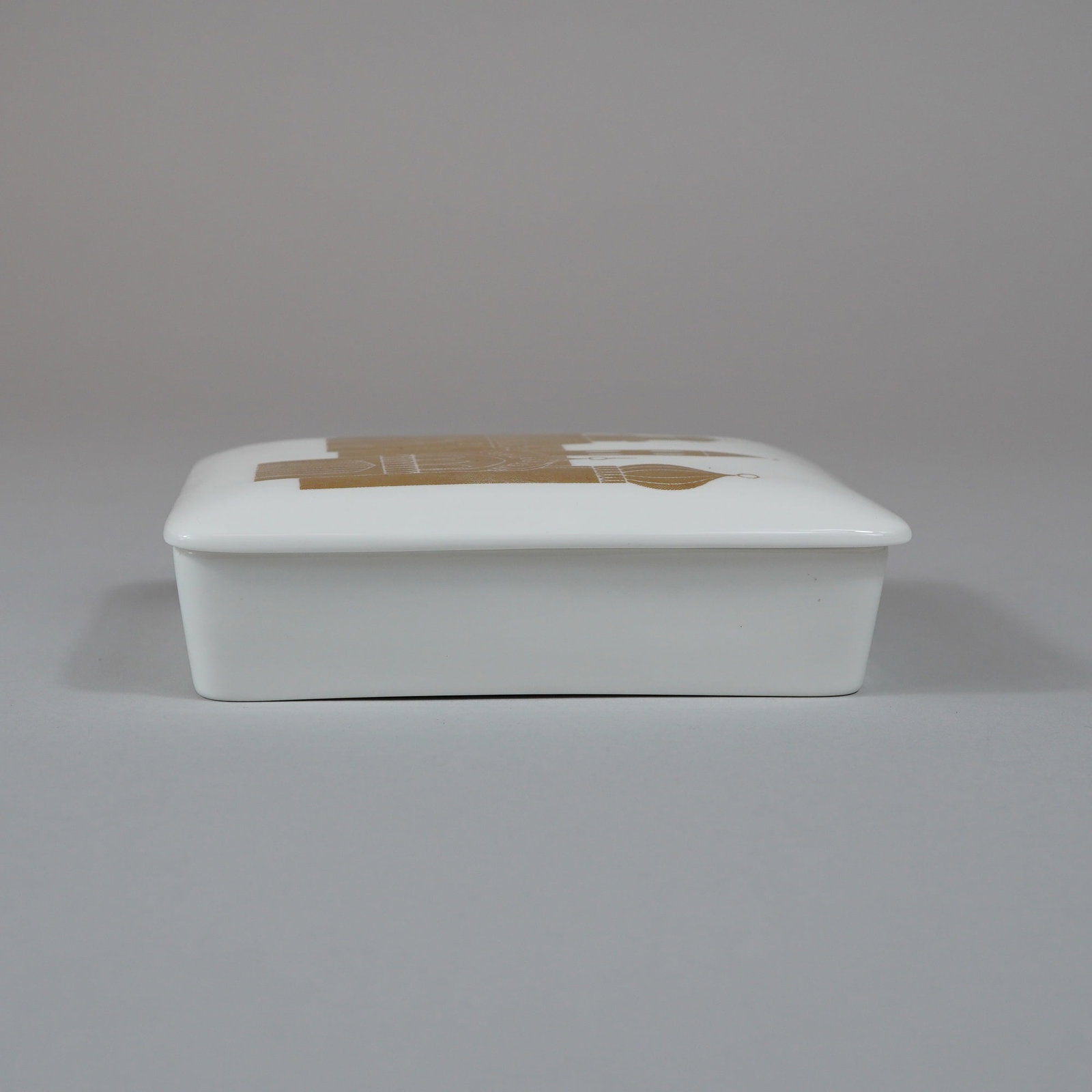 Wedgwood Bone China Rectangular Trinket Box: This rectangular trinket box is crafted from fine bone china by Wedgwood as part of the Rubin Collection. The piece consists of a white glazed base with a matching fitted, slightly domed lid. The lid 