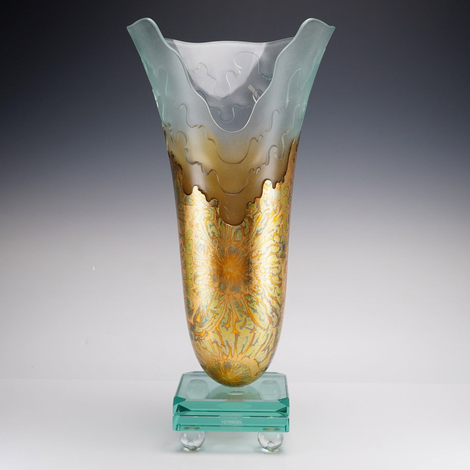 Salvatore Polizzi Etched Glass with Gold Wave Vase on Crystal Pedestal Base: A contemporary art glass wave vase by Salvatore Polizzi, Los Angeles. The vessel features a tapered body with a flared, undulating rim. The upper portion is crafted from frosted glass with etched, wav