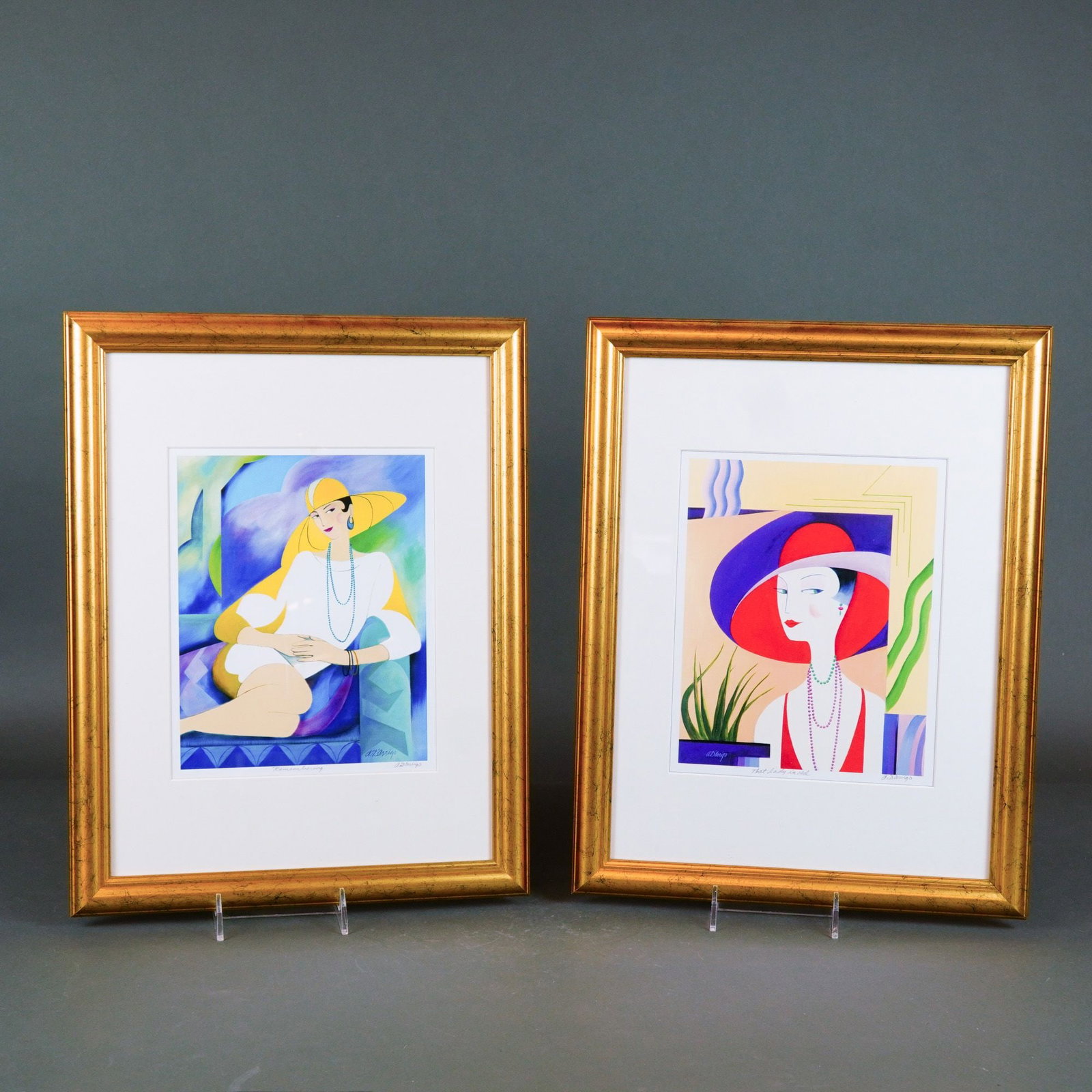 Pair of Anthony D'Arrigo (American) Lithographs, 'Remembering' and 'That Lady in Red': This pair of color lithographs by Anthony D'Arrigo, titled Remembering and That Lady in Red, features stylized, Art Deco-inspired portraits of elegant women. Remembering depicts a woman reclining in a