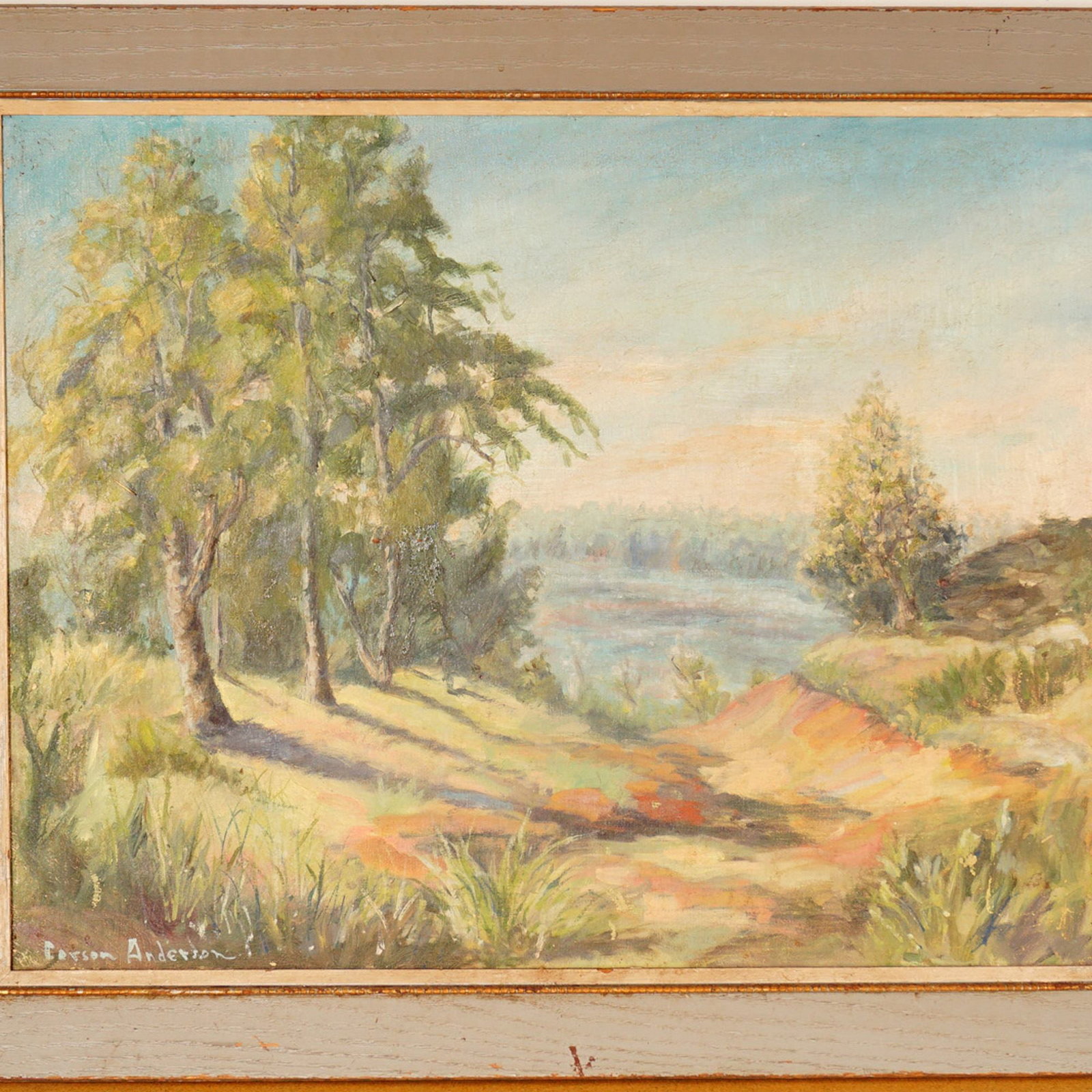 Carson Anderson, Oil on Canvas Painting, Lakeside Landscape, Signed: An original oil on canvas painting signed Carson Anderson at the lower left. The composition depicts a tranquil lakeside view with a sloping shoreline and clusters of sunlit trees along the water's ed