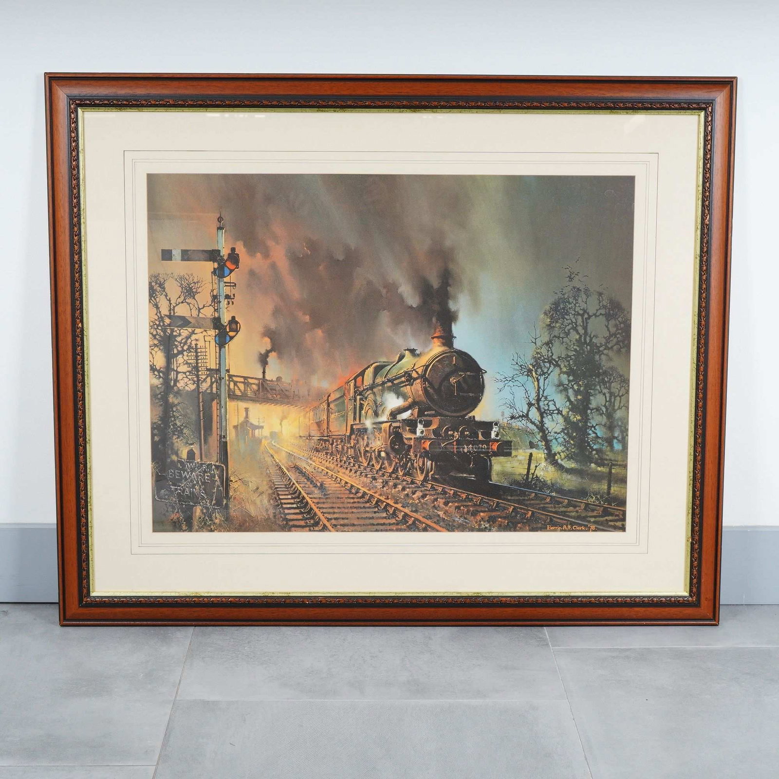 Barrie A.F. Clark, Pendennis Castle GWR 4079 Locomotive Color Print, 1978: This color print of the GWR 4079 Pendennis Castle locomotive is by British aviation artist Barrie A. F. Clark. The artwork, dated 1978, features the green steam engine pulling a set of carriages throu