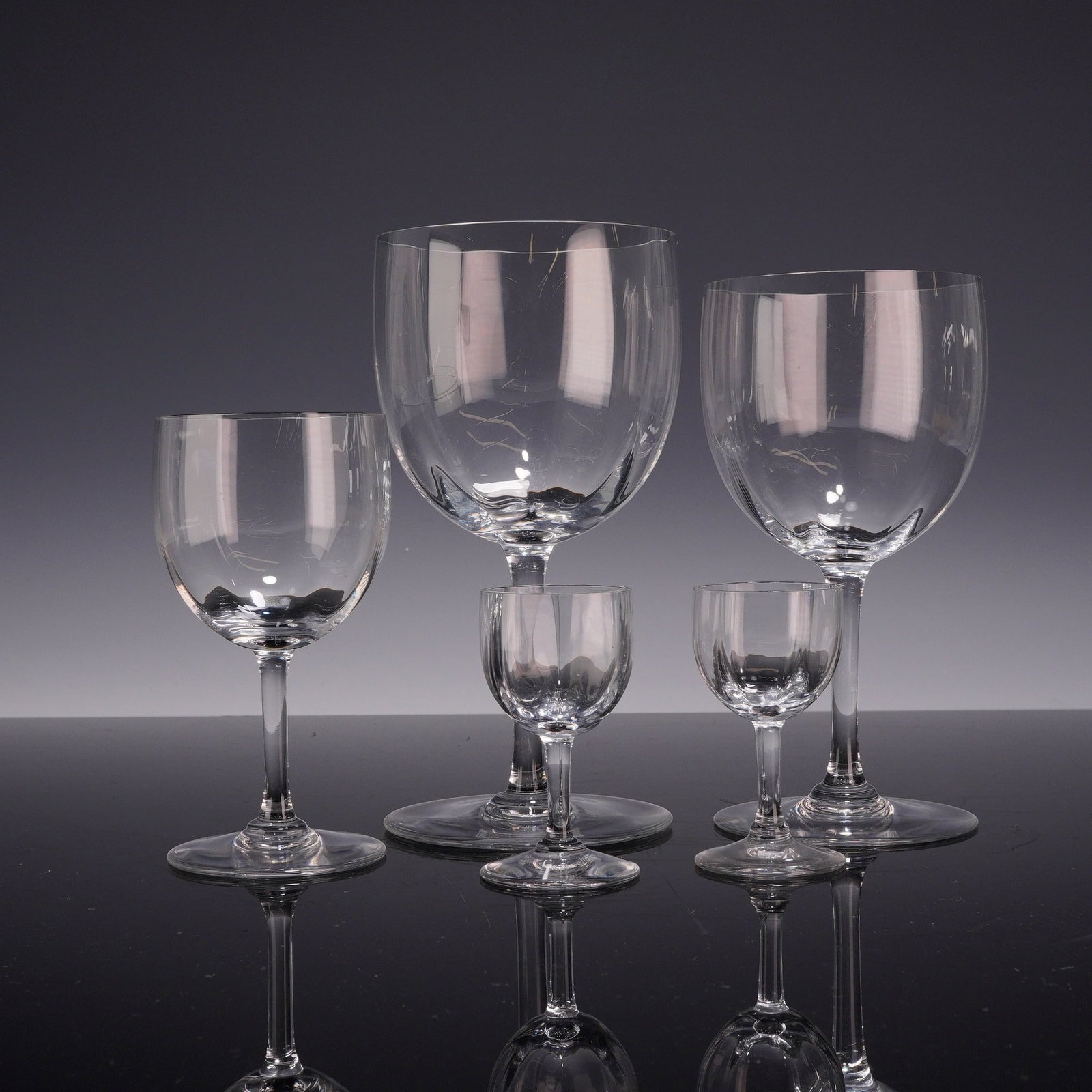 5pc Baccarat Montaigne Optic Crystal Stemware Pieces: This set of colorless lead crystal stemware is manufactured by Baccarat in the Montaigne pattern with an optic finish. The collection includes one water goblet, one wine glass, one sherry glass, and t