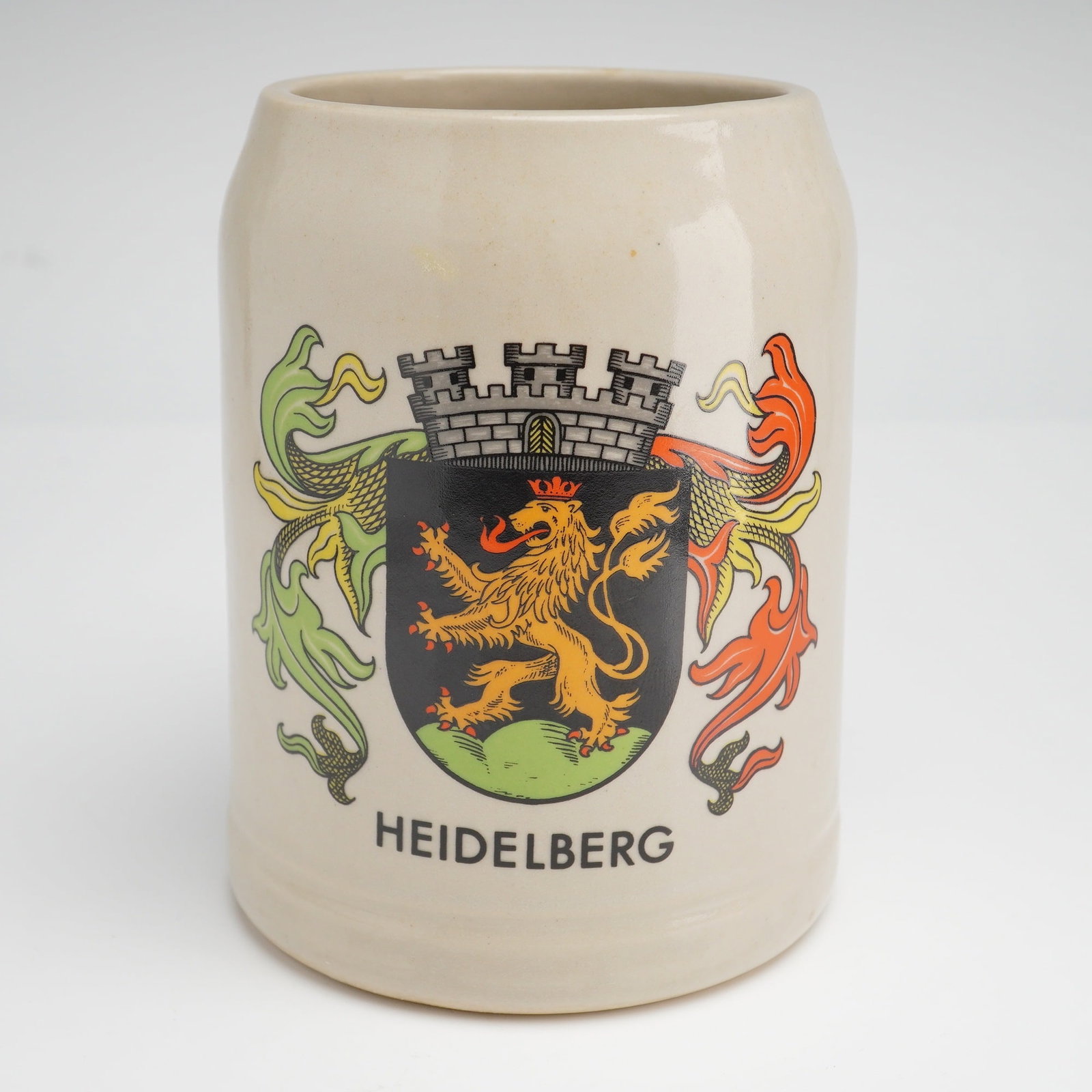 Goebel Hummel and Heidelberg Figurine and Beer Mug, Mid-20th Century: A Pair of German collectibles including a 2pc Goebel Hummel Figurine Ed the Wine Steward and Heidelberg Mug. The beer mug is a 0.5-liter Keferloher style vessel crafted from glazed grey stoneware. It 