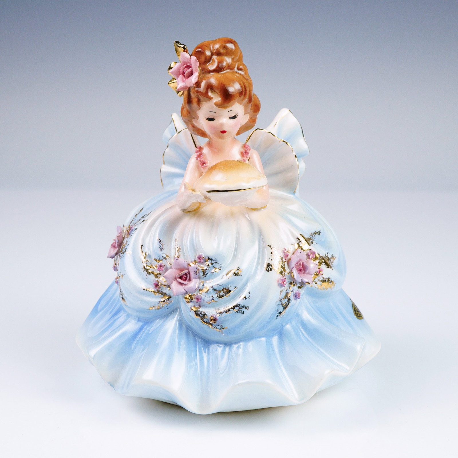 Originals Porcelain Figurine, Birthday Girl Series, May: This charming vintage figurine by Josef Originals represents the month of May from their iconic Birthday Girls series. The figurine features a graceful young girl dressed in a full, flowing gown with 