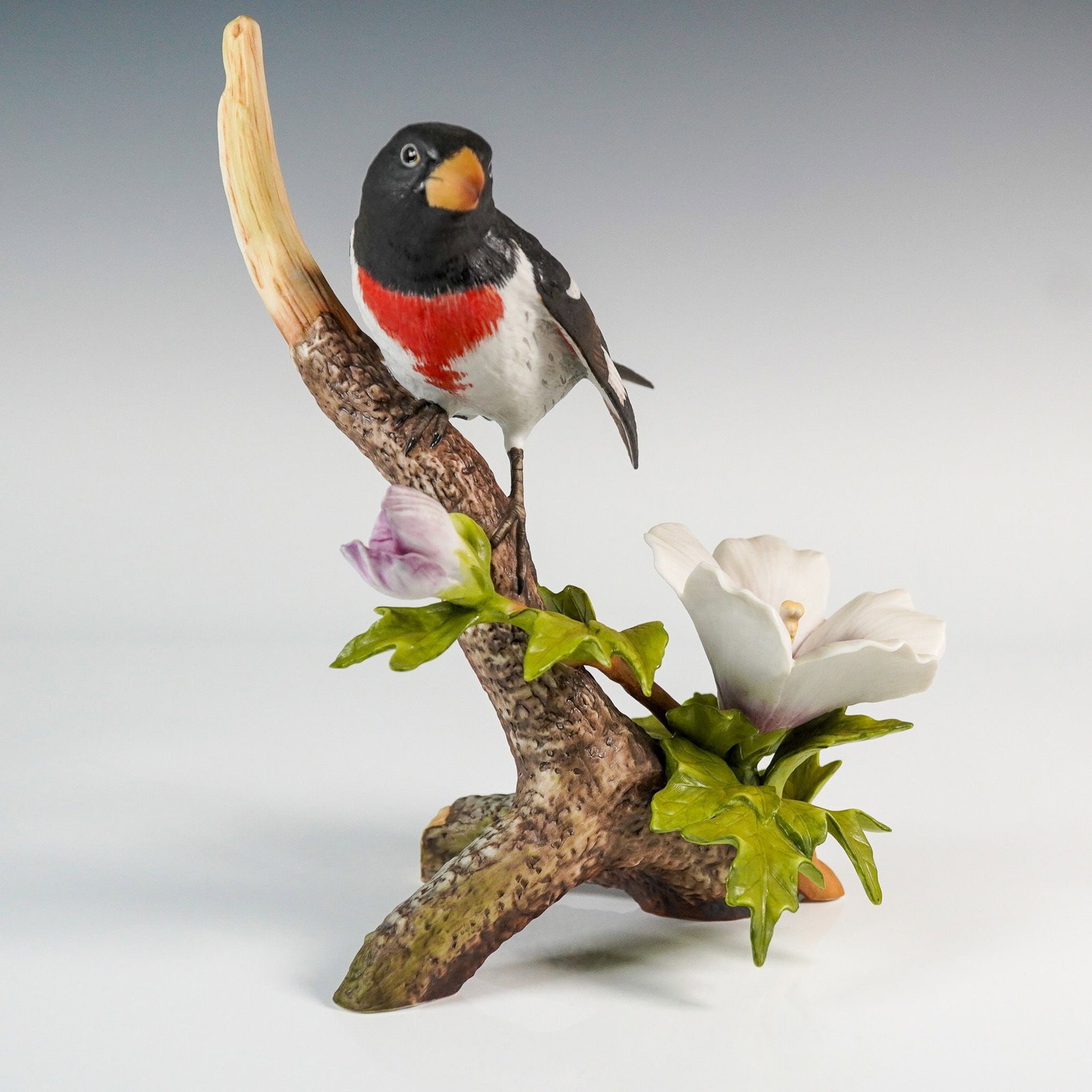 National Audubon Society Rose-Breasted Grosbeak Figurine by Arthur Singer: Porcelain bird figurine from the National Audubon Society, designed by renowned American wildlife artist Arthur Singer. This limited edition sculpture depicts a rose-breasted grosbeak perched graceful