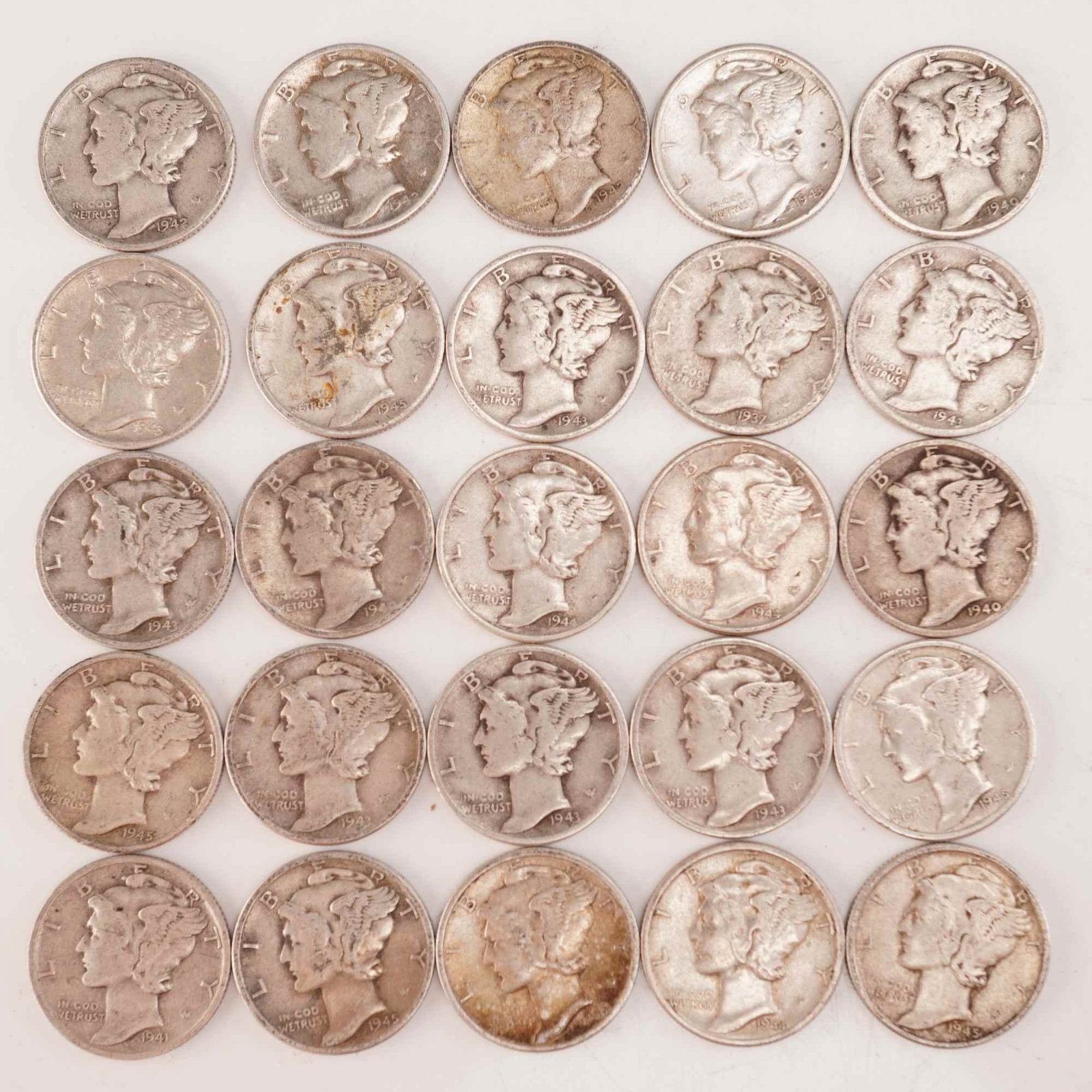 Lot of 25 Loose Mercury 90% Silver Dimes, Circulated: Obverse designed with an allegory of Liberty wearing a winged Phrygian cap (freedom of thought) is surrounded with the word "LIBERTY" and accompanied with the motto: "IN GOD WE TRUST". Reverse fasces 
