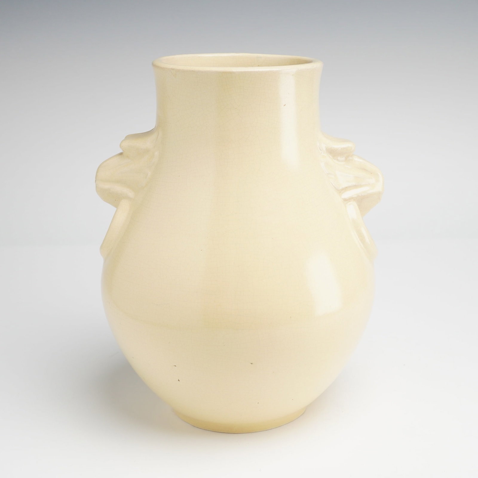 Weller Pottery Ting Ware Vase: A Weller Pottery earthenware vase from the Ting Ware line, produced circa the late 1920s to early 1930s. This American Art Pottery piece features a monochrome, high-gloss ivory glaze over a bulbous, p
