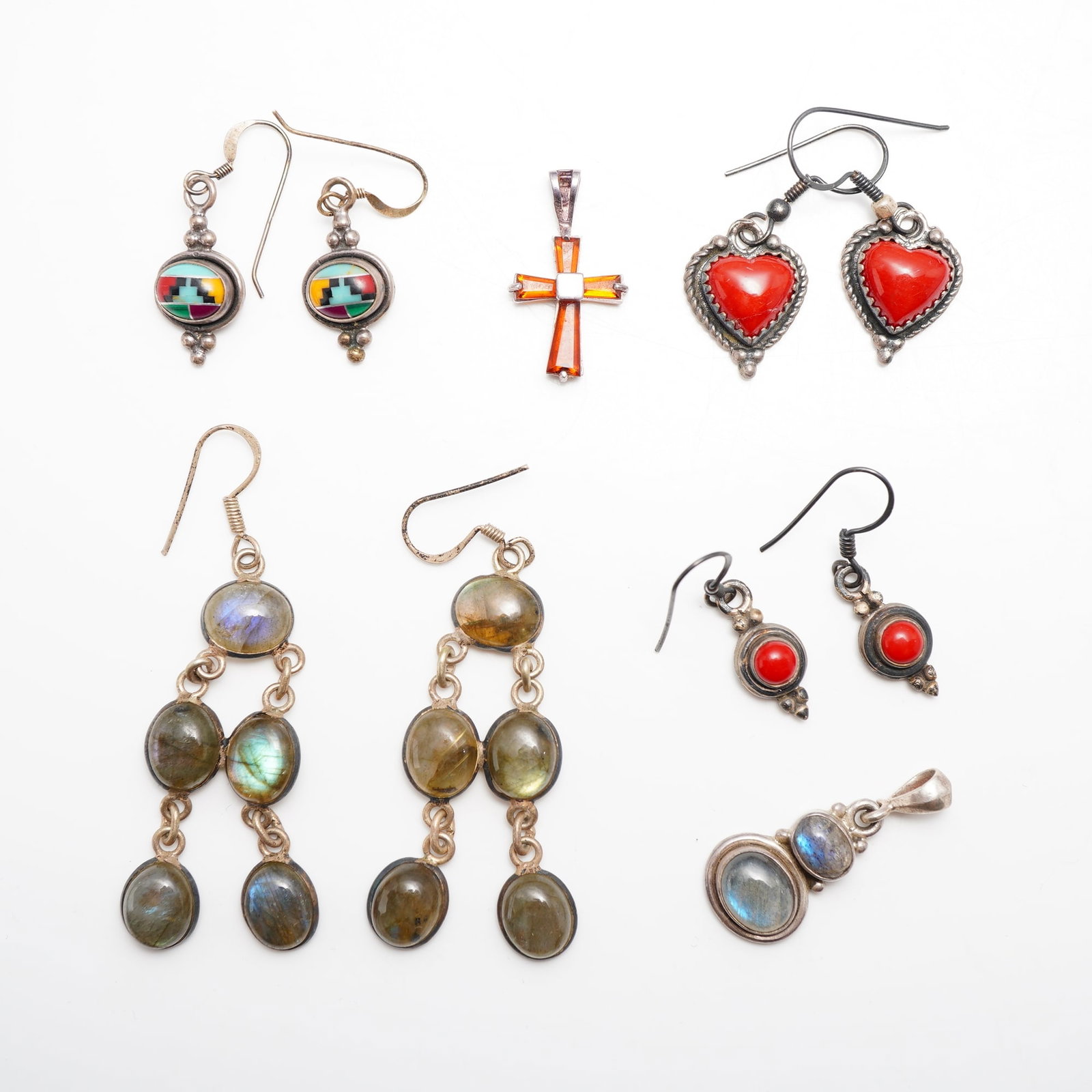 10pc Sterling Silver and Gemstone Jewelry Collection with Earrings and Pendants: This 10pc sterling silver and gemstone jewelry collection includes four pairs of earrings, two pendants. The assortment features a pair of Zuni-style circular drop earrings with geometric stone-to-sto