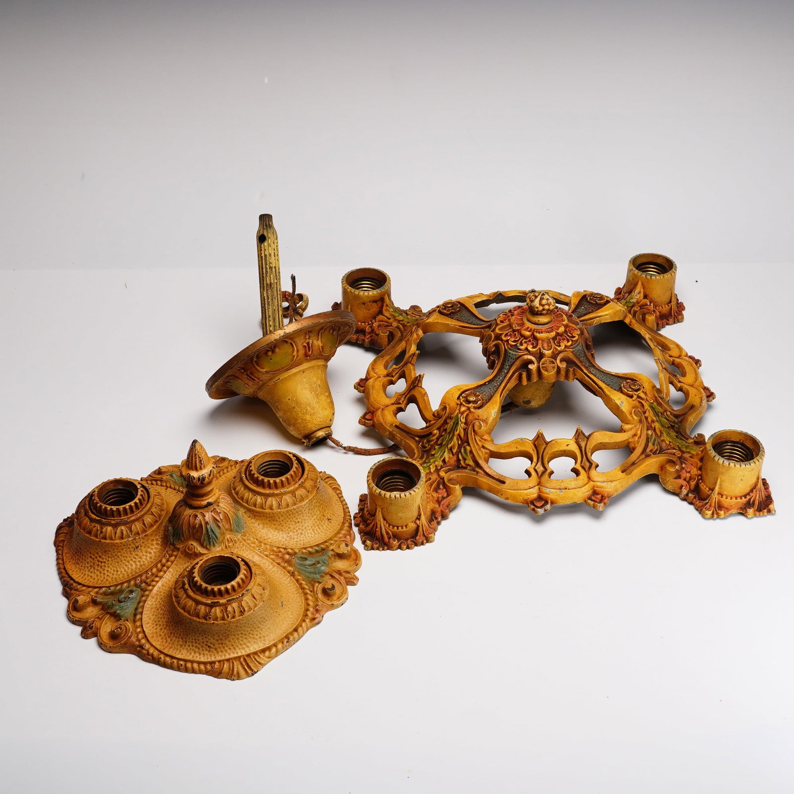 Moe Bridges Cast Metal Art Nouveau Chandelier: This two-piece lot features vintage lighting fixtures manufactured by the Moe Bridges Company of Milwaukee, including a five-light openwork chandelier frame and a three-light hammered-texture flush mo