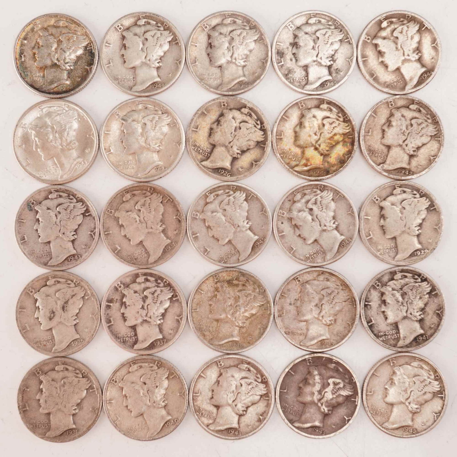 Lot of 25 Loose Mercury 90% Silver Dimes, Circulated: Obverse designed with an allegory of Liberty wearing a winged Phrygian cap (freedom of thought) is surrounded with the word "LIBERTY" and accompanied with the motto: "IN GOD WE TRUST". Reverse fasces 