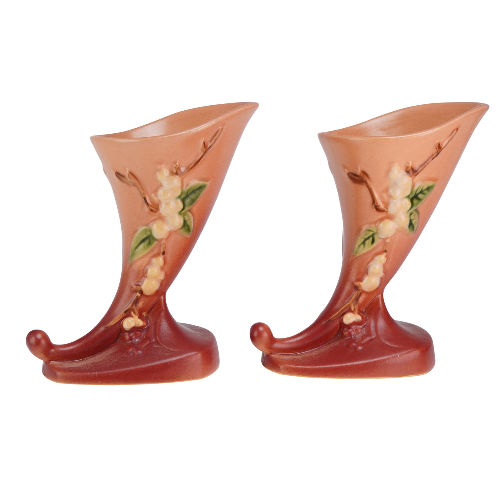 A Pair of Roseville Cornucopia Vases, Snowberry Pink 1CC-6: A pair of Roseville Pottery cornucopia vases in the Snowberry pattern. These earthenware vases feature a matte spray-glazed finish with a chromatic gradient transitioning from a dusky pink at the rim 