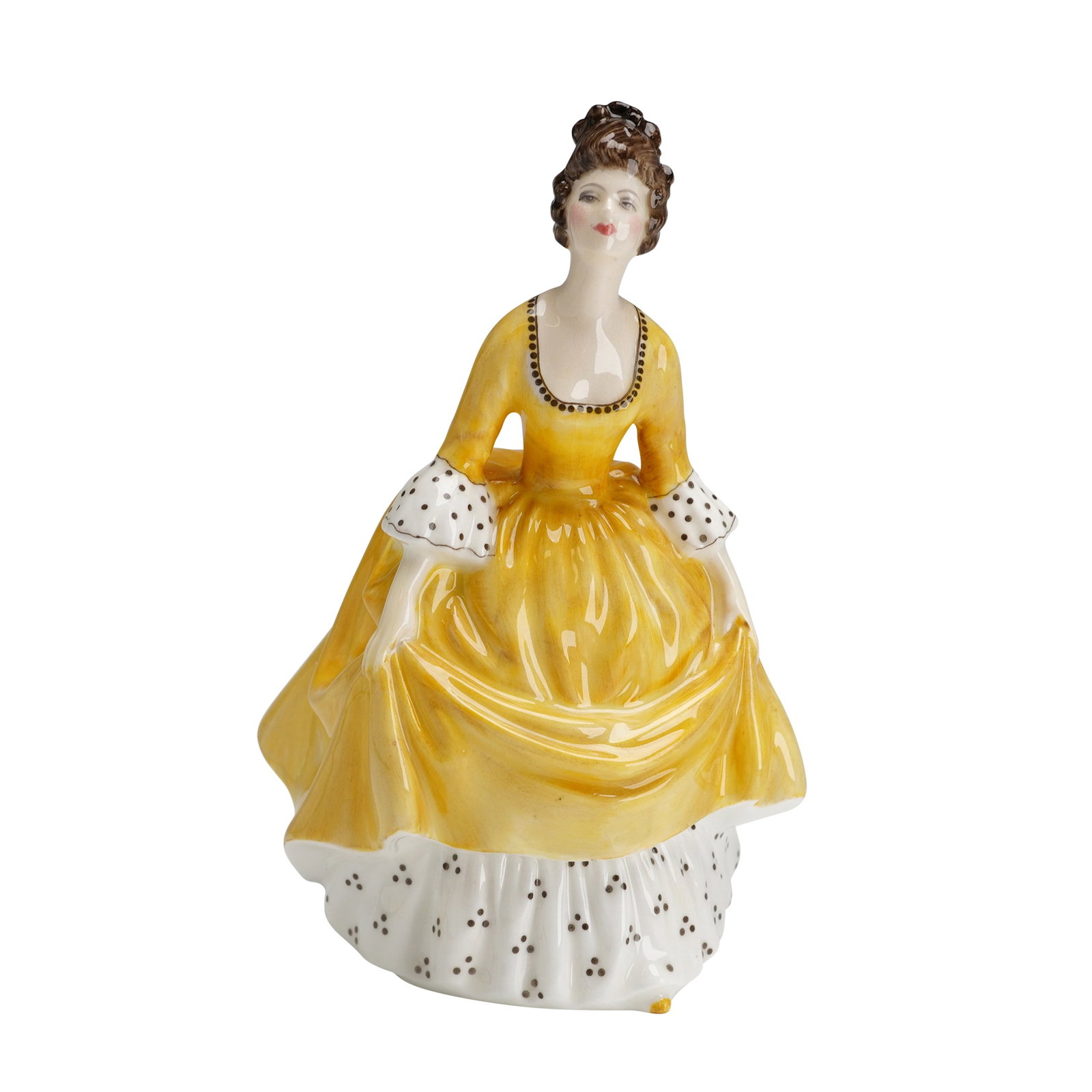 Royal Doulton Bone China Figurine, Coralie HN2307: A Royal Doulton bone china figurine titled Coralie, model HN 2307. The figure is depicted in a yellow gown with a white underskirt and sleeve cuffs featuring black polka dots. The piece includes hand-