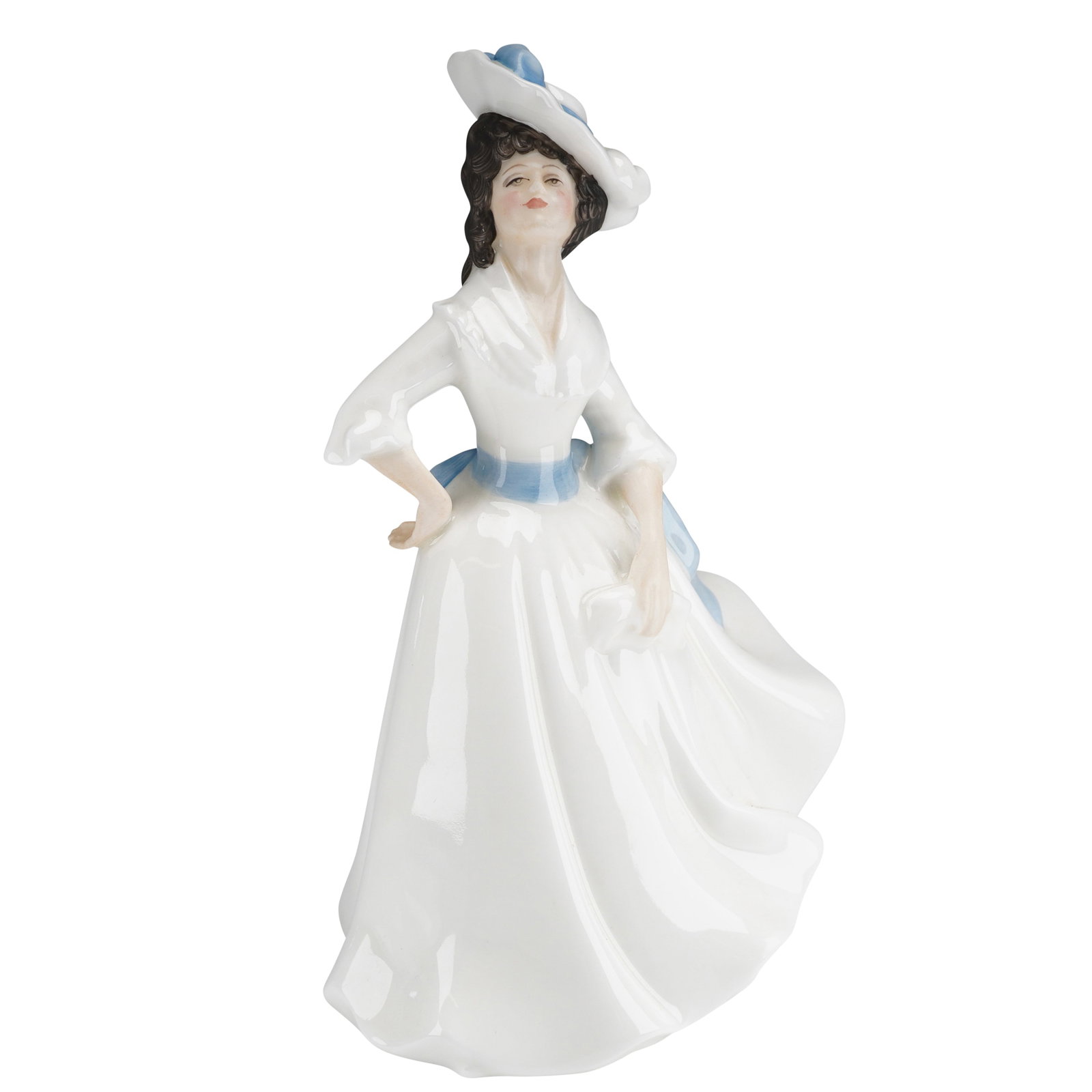 Royal Doulton Figurine Margaret HN2397: A glazed bone china figurine by Royal Doulton, depicting a standing woman in a long white dress, accented by a flowing blue sash and coordinating ribbon details on her wide-brimmed hat. The base featu