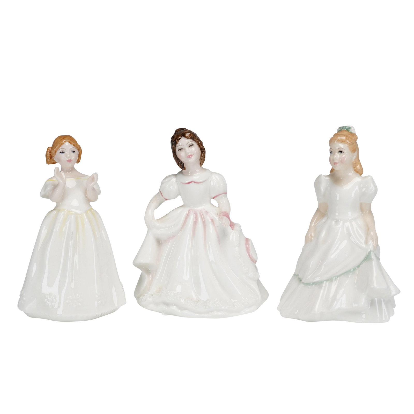 3pc Royal Doulton Porcelain Figurines, Kerry HN3461, Catherine HN3451, and Amanda HN3406: This lot includes three Royal Doulton glazed figurines representing young girls. Each piece is crafted from fine bone china and features hand-decorated details in a cream and pastel palette. The group