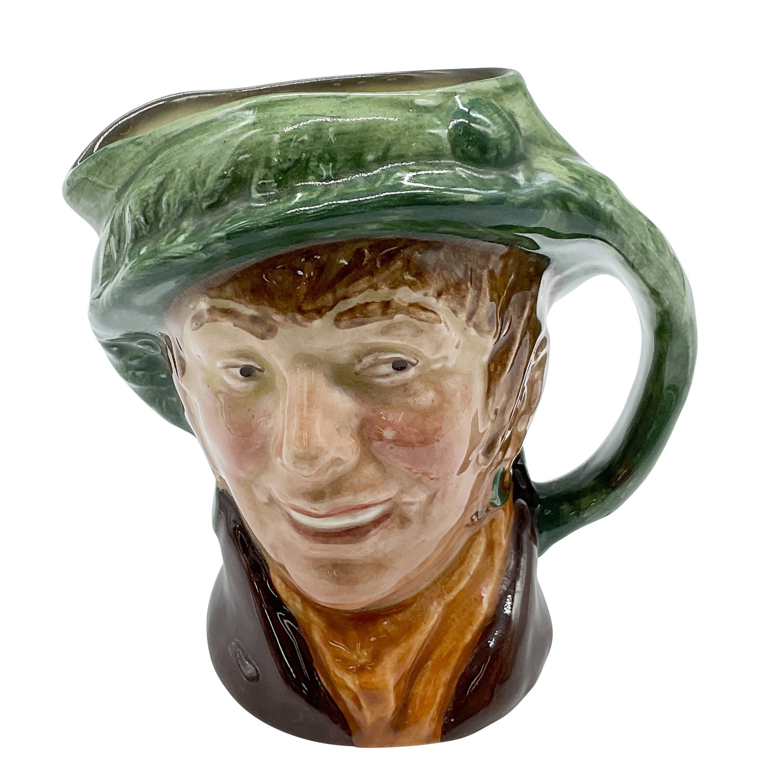 Arriet D6236 - Small - Royal Doulton Character Jug: Part of the Street Vendors series. Jug colored in green hat; brown coat; yellow scarf. Royal Doulton backstamp. Artist: Harry Fenton Dimensions: 3.5"L x 3"W x 3.5"H Date or Era: 1947-1960 Manufacturer