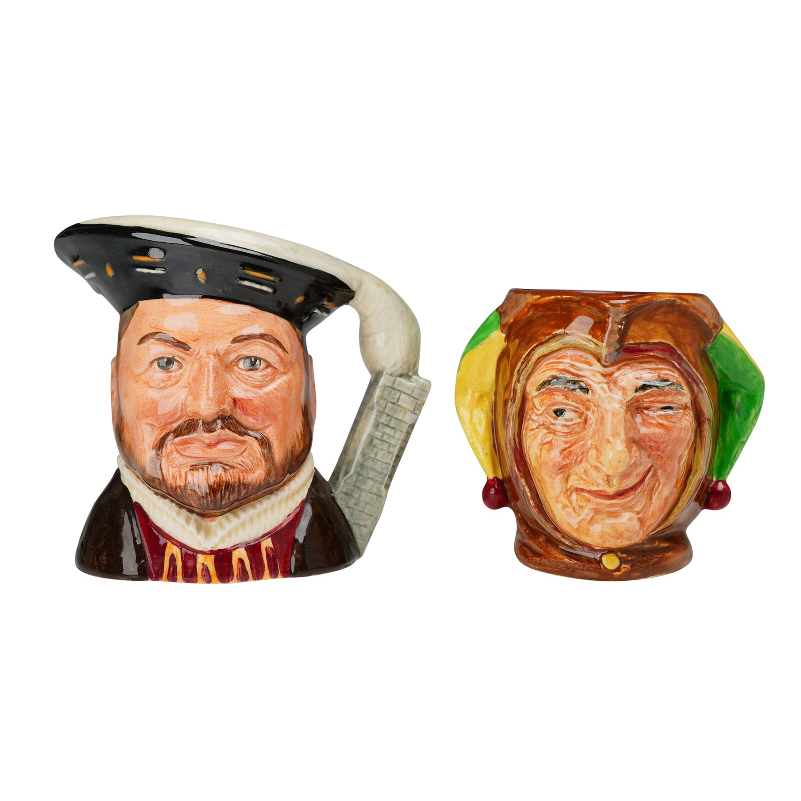 2pc Royal Doulton Character Jugs, Henry VIII D6647 and Jester D5556: This lot consists of two Royal Doulton glazed earthenware character jugs. The first jug depicts King Henry VIII, model number D 6647. The figure is rendered with a brown beard and mustache, wearing a 