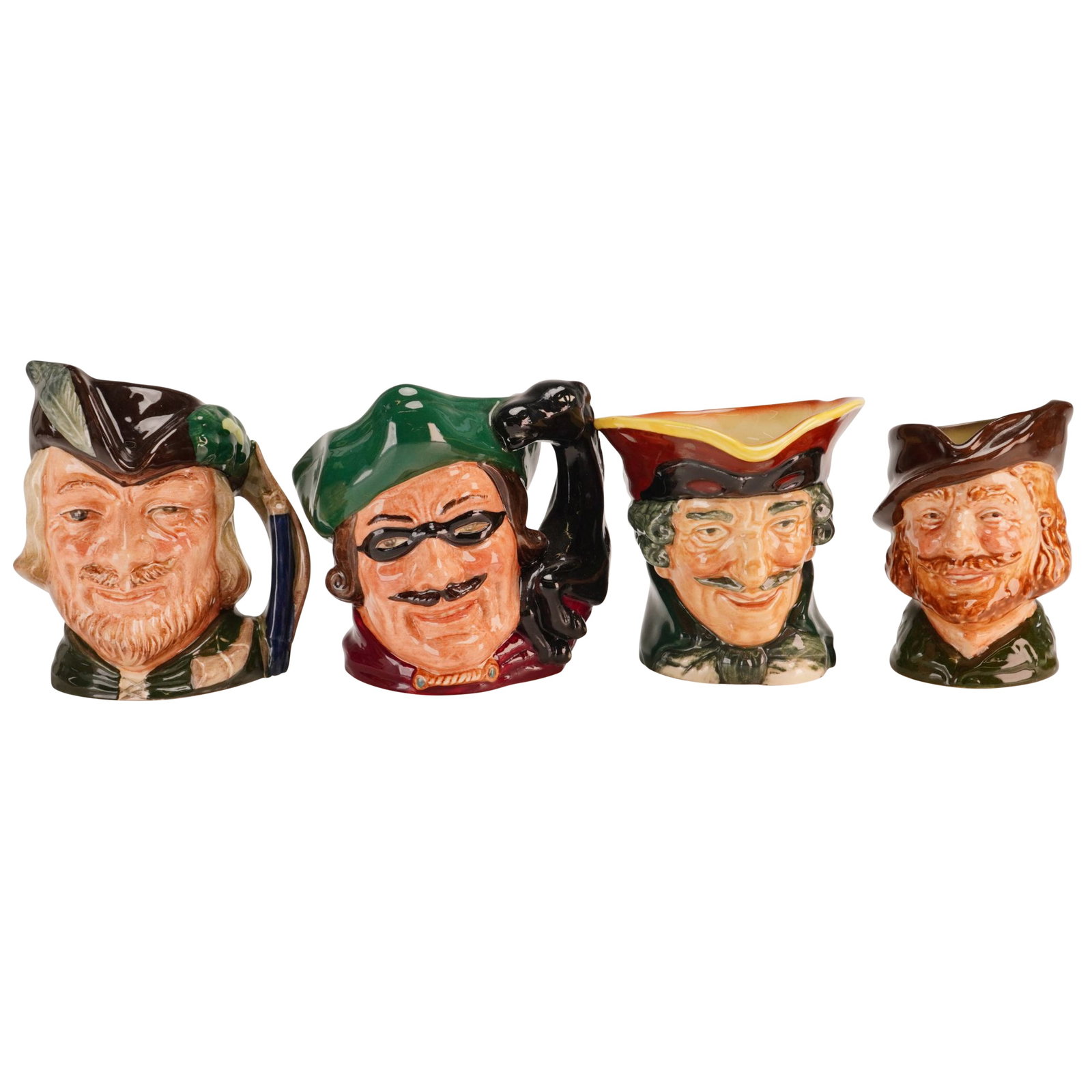 4pc Royal Doulton Small Character Jugs- D5618, 6535, 6534 & Old 6234: A collection of 4pc Royal Doulton Small Character Jugs crafted in glazed earthenware. This set features two iconic historical and legendary figures: Robin Hood and the highwayman Dick Turpin. Each cha