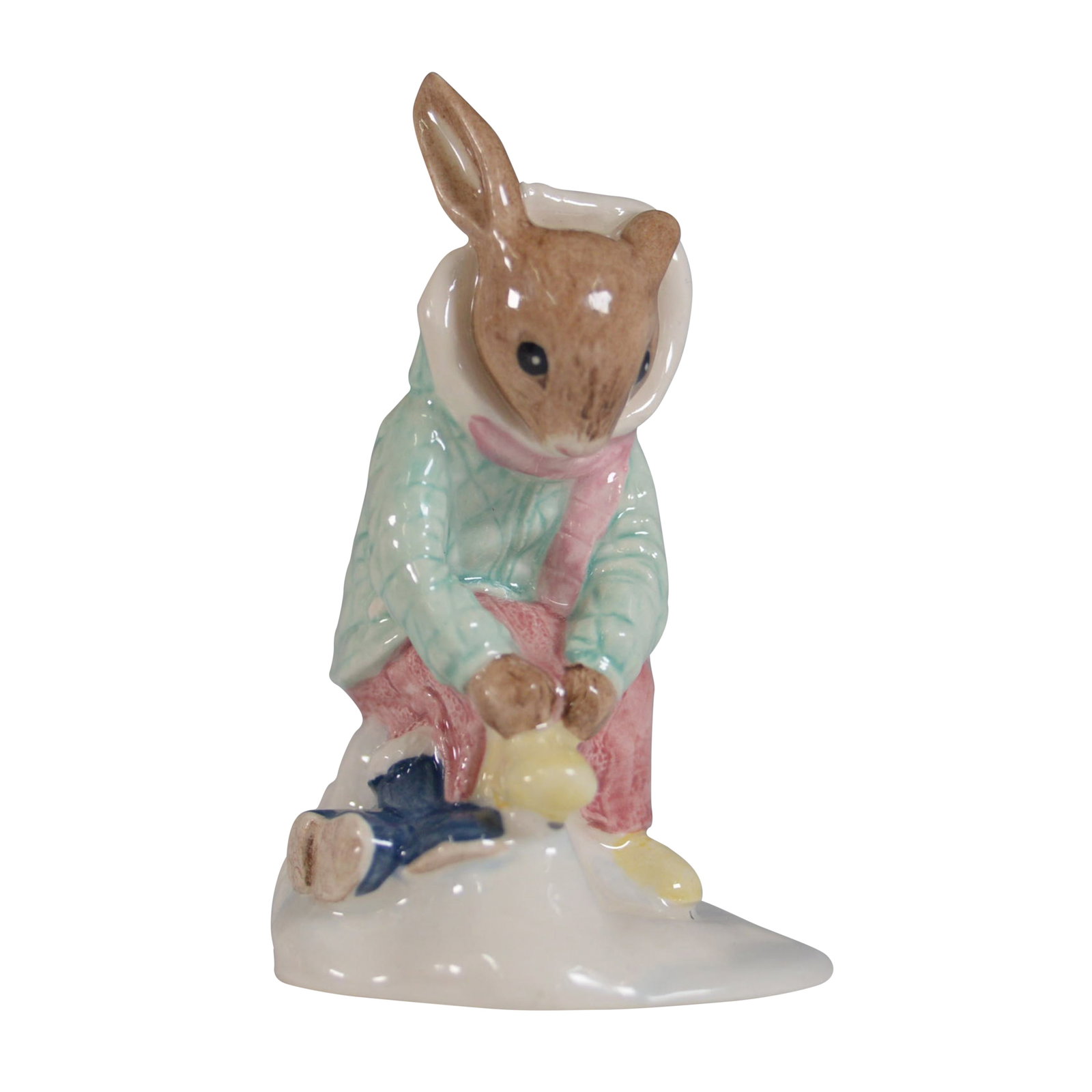 Royal Doulton Bunnykins Figurine, Girl Skater DB153: This delightful Royal Doulton Bunnykins figurine, titled "Girl Skater Bunnykins" (DB153), depicts a bunny dressed in a charming winter outfit, skating gracefully. The figurine stands 3.5"H and is in e