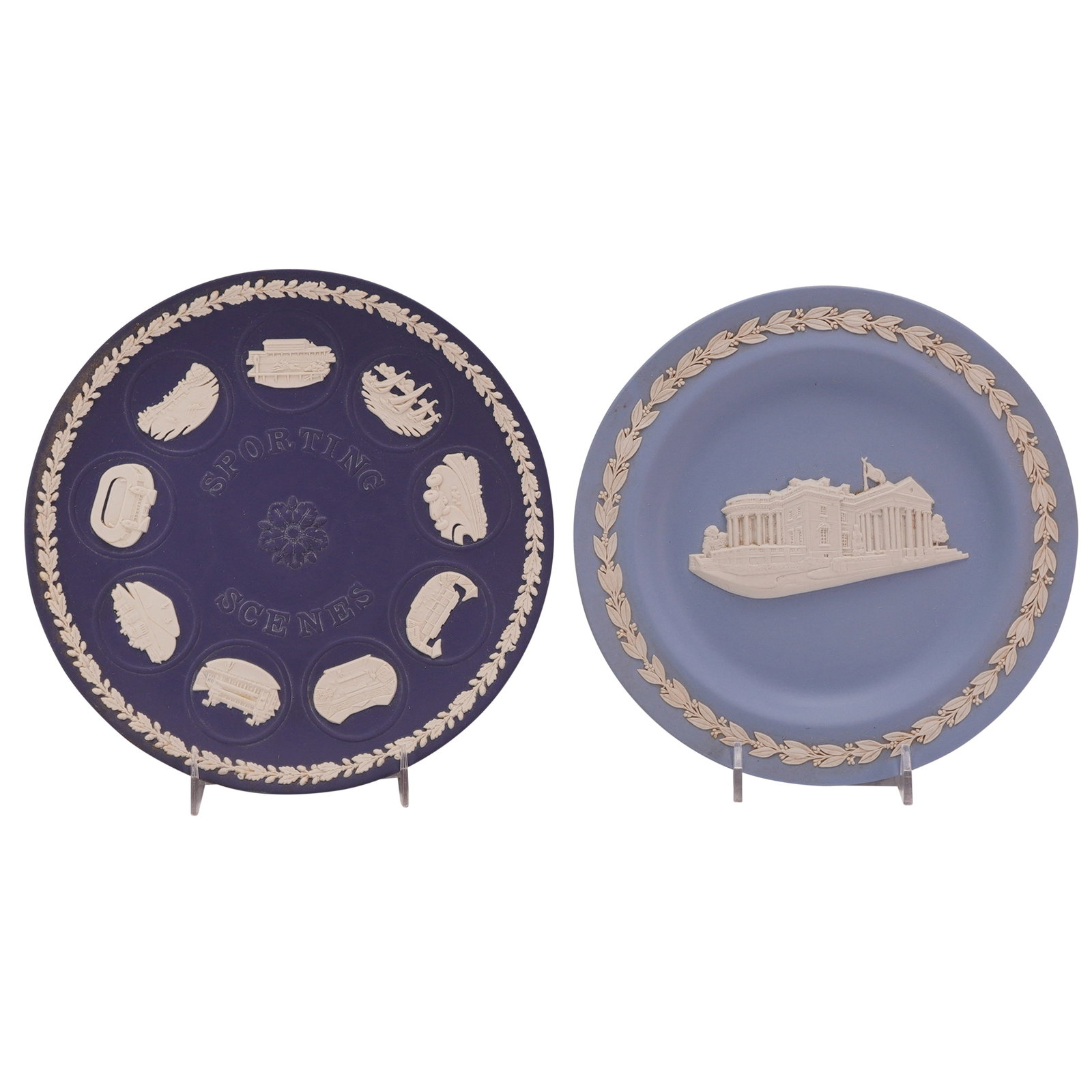 Two Wedgwood Jasperware Commemorative Plates, Sporting Scenes and 250yrs Innovation & Artistry: This lot consists of two circular Wedgwood Jasperware stoneware plates featuring hand-applied white sprigged bas-relief decoration. The first plate is executed in a dark Portland Blue ground and featu