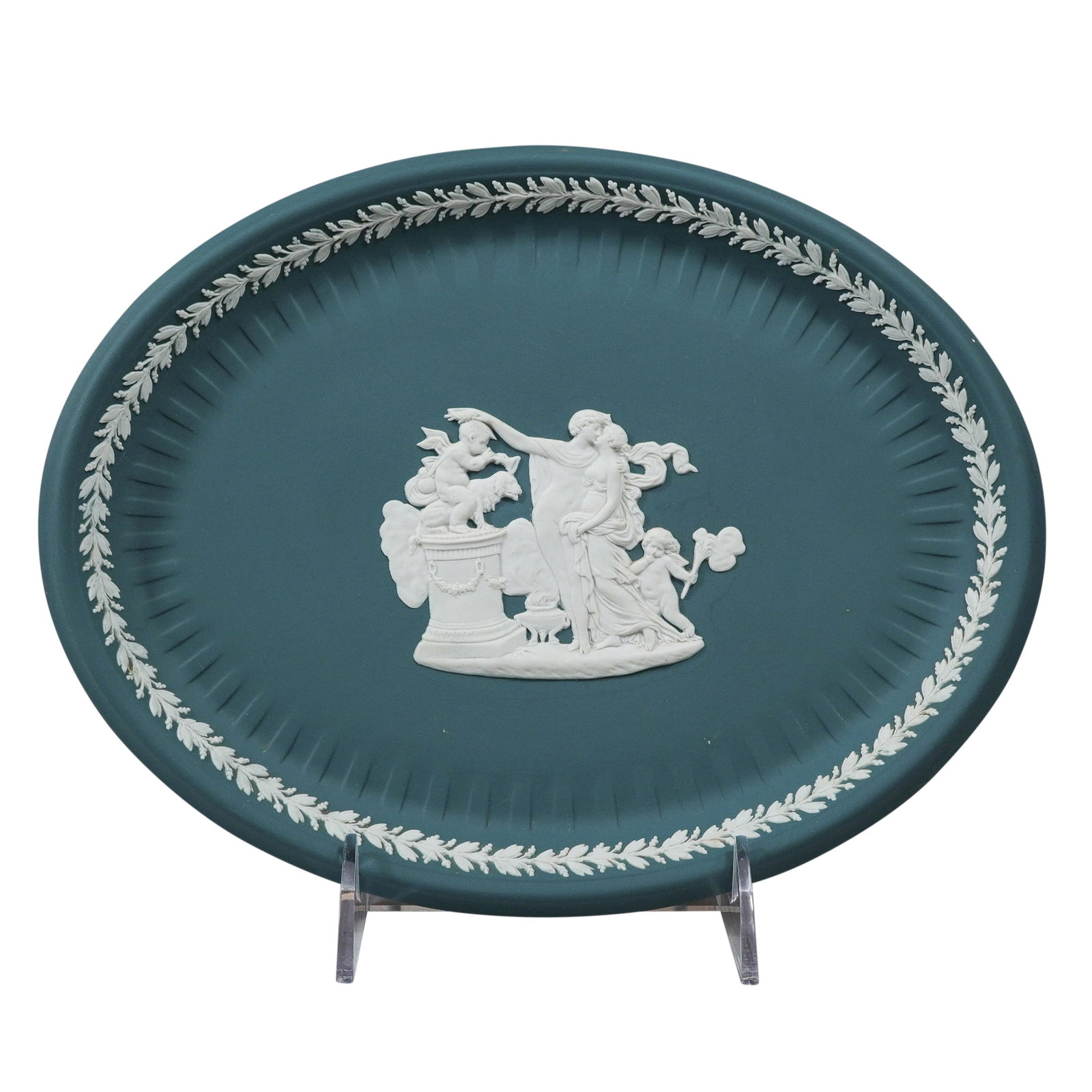 Wedgwood Teal Jasperware Oval Platter with Neoclassical Bas-Relief: A large Wedgwood jasperware oval tray featuring a teal green matte-finish stoneware body. The center of the well is decorated with white sprigged bas-relief neoclassical imagery depicting a central dr