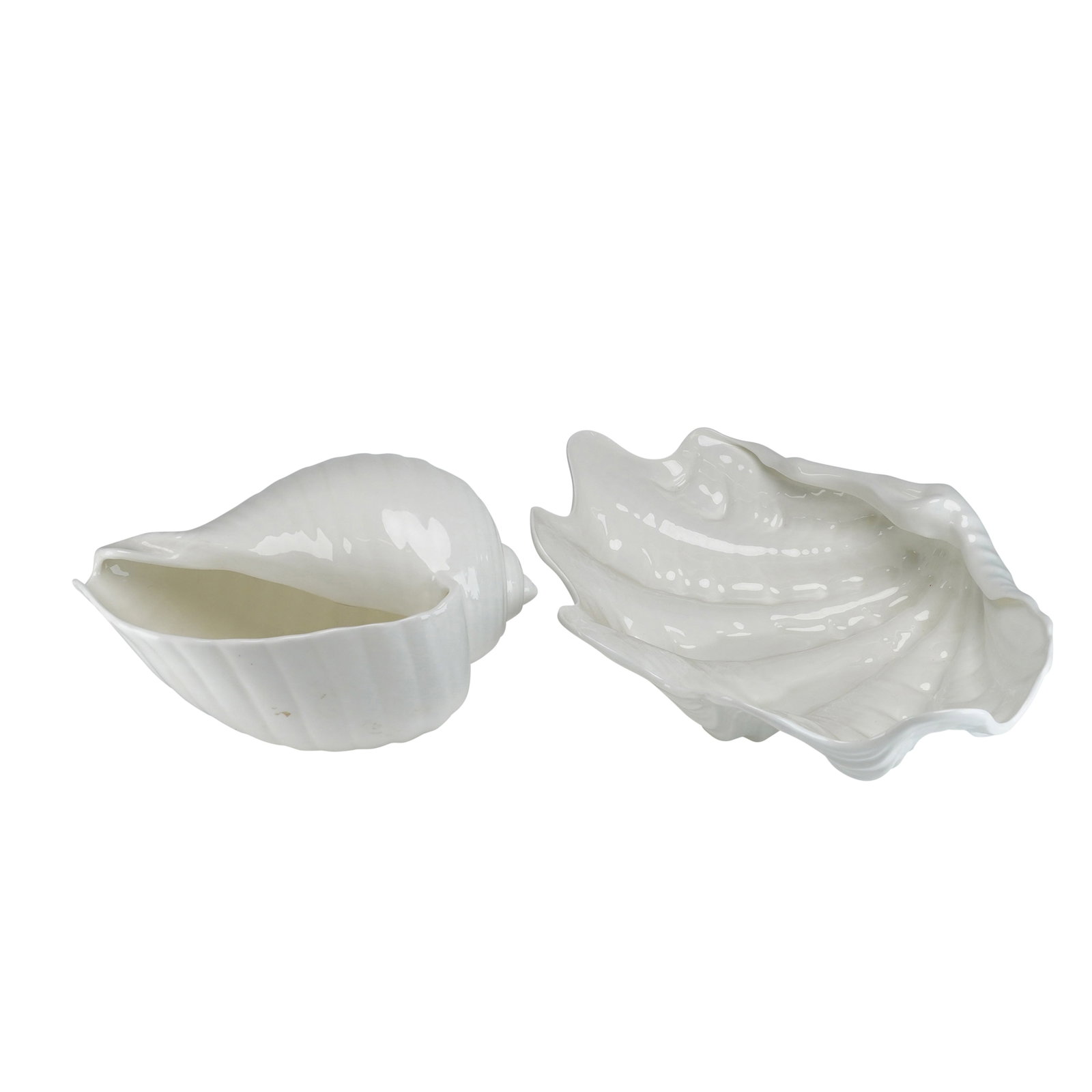2pc Wedgwood Nautilus Collection Bone China Shell Bowls: A pair of Wedgwood bone china decorative bowls from the Nautilus Collection. These items are molded in the forms of natural seashells and finished with a high-gloss monochromatic white glaze. One vess