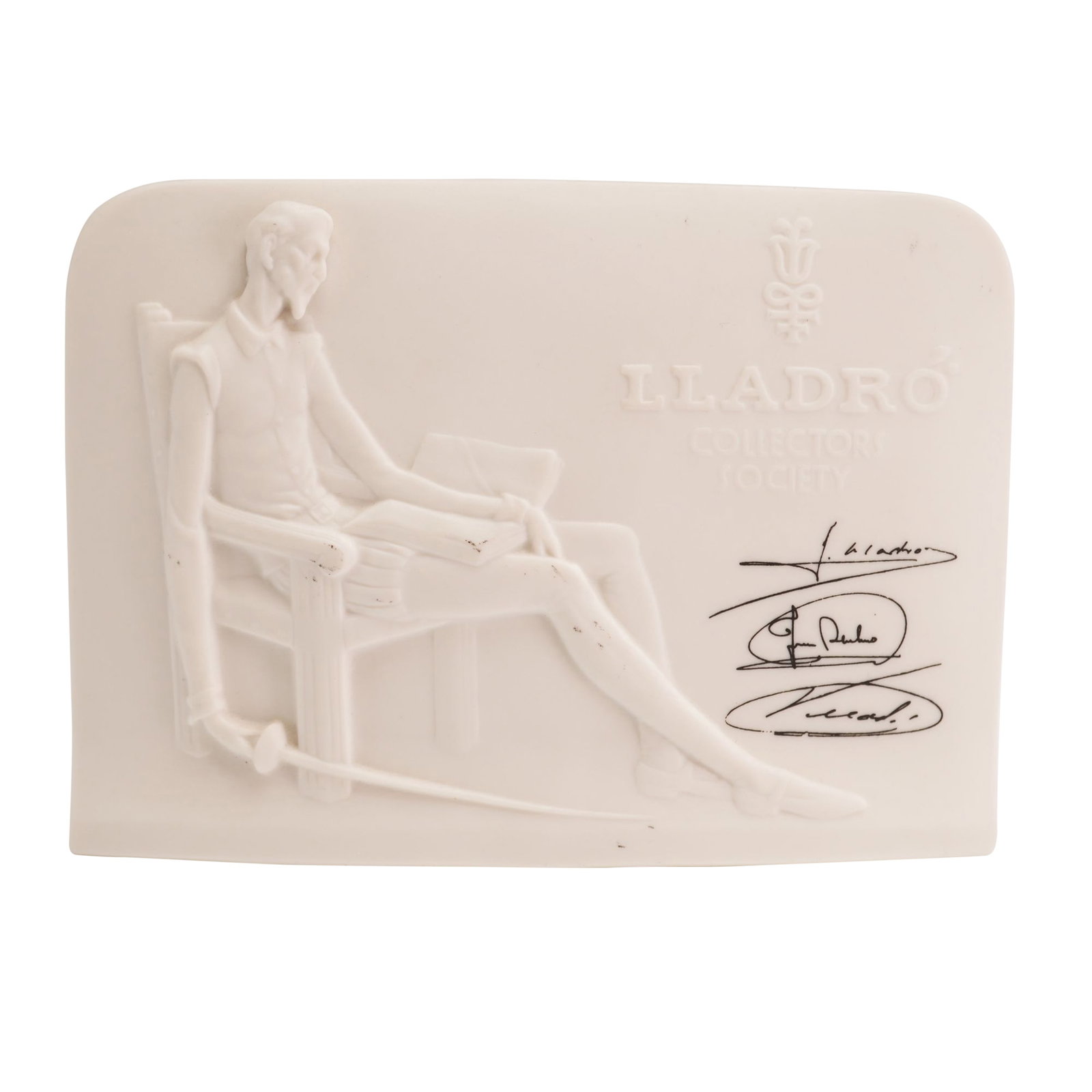 Lladro Matte Porcelain Charter Member Plaque, Don Quixote 01017601: Signed Collectors Society tablet displaying Don Quixote with a book and a sword, issued 1985. Lladro backstamp. Dimensions: 6.00"L x 2.25"W x 4.25"H Weight: 11.00oz