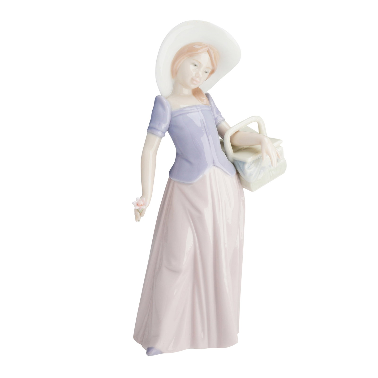Lladro Glazed Porcelain Event Figurine Tailor Made 01006489: Lladro glazed porcelain figurine, model number 6489, titled Tailor Made. This piece depicts a young girl in a wide-brimmed white hat, a short-sleeved lavender blouse with a ruffled peplum, and a long,