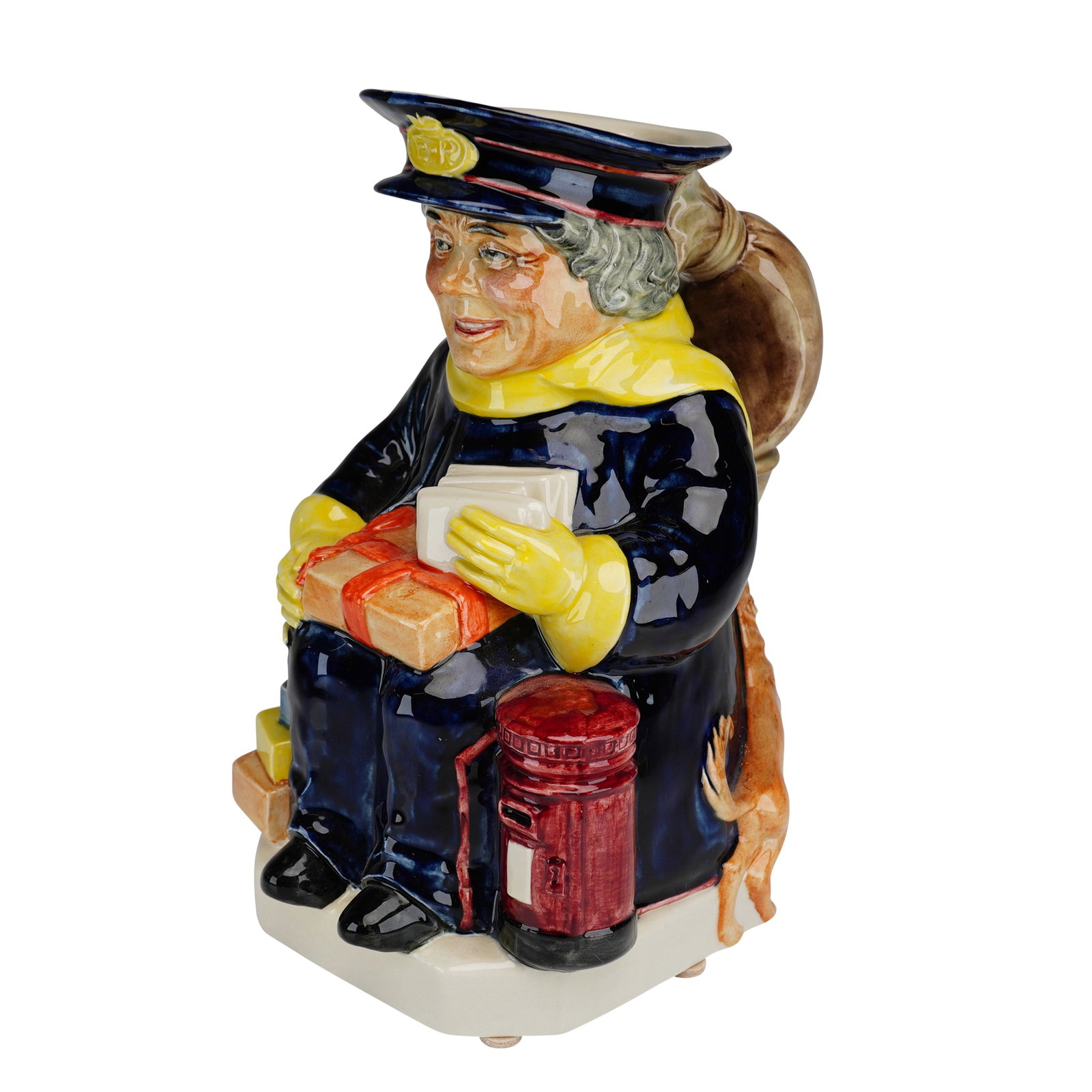 Kevin Francis Ceramics Limited Edition Toby Jug, The Postman with COA: A hand-made and hand-painted glazed ceramic Toby jug titled The Postman, modeled by Peggy Davies for Kevin Francis Ceramics Ltd. The figure is depicted seated, wearing a dark blue postal uniform with 
