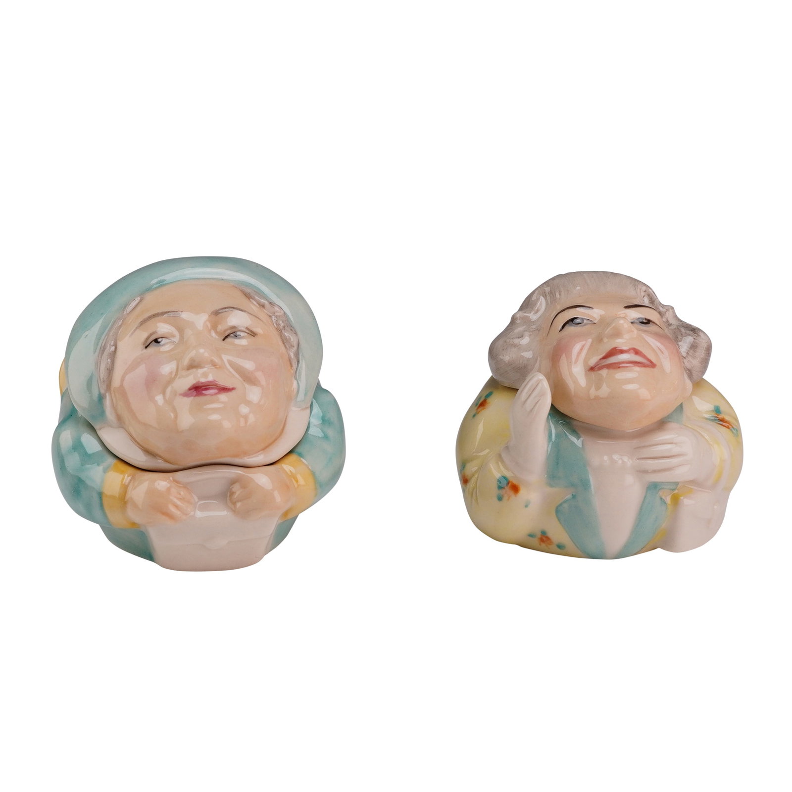 Two Kevin Francis Face Pots, Queen Mother and Queen Elizabeth II: A pair of hand-painted glazed ceramic lidded trinket pots from the Face Pots collection by Kevin Francis, produced in 2001. These pieces are designed as caricatured busts of H.R.H. The Queen Mother an